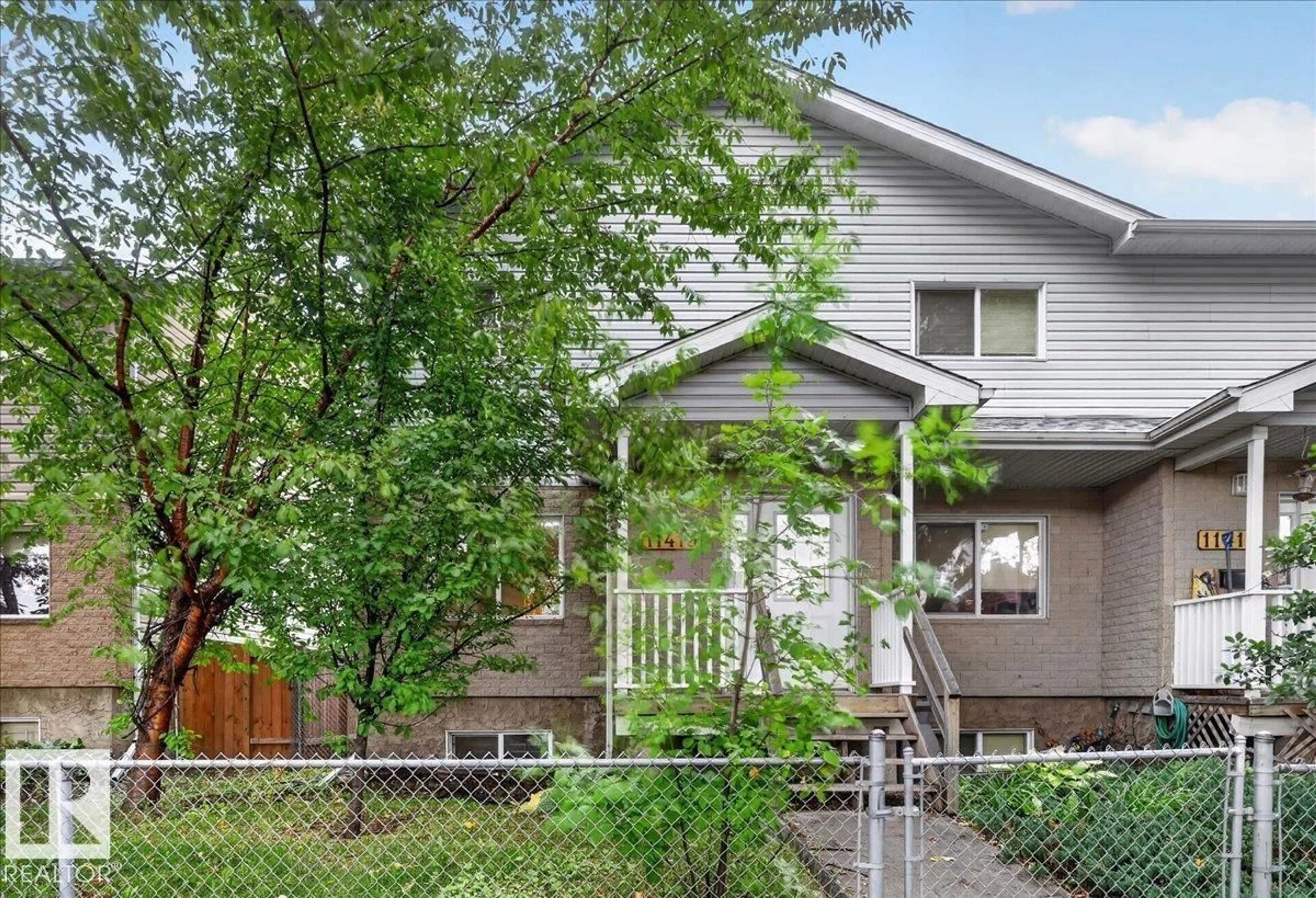 Home with vinyl exterior material, street for 11413 96 ST, Edmonton Alberta T5G1T5