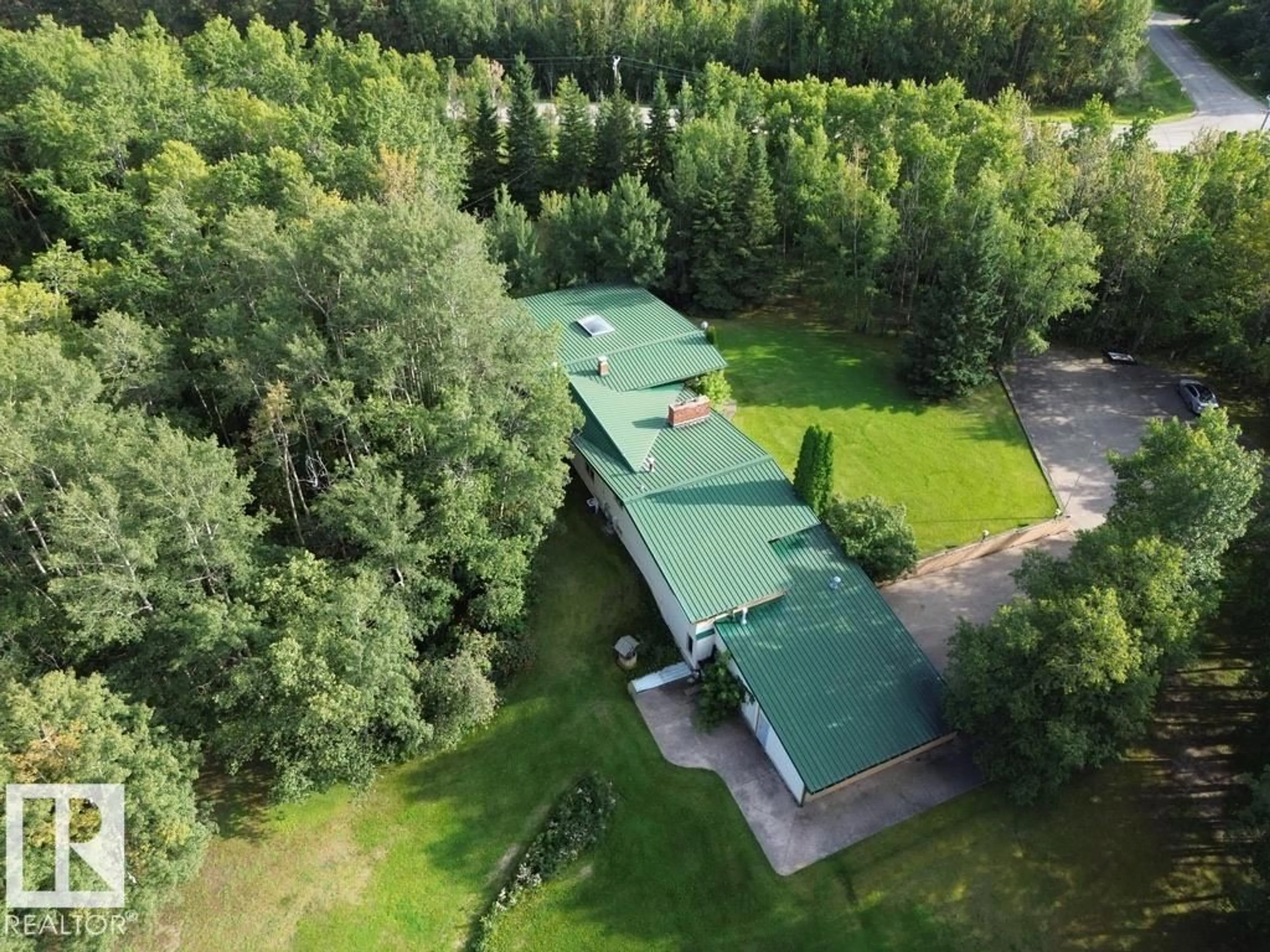 A pic from outside/outdoor area/front of a property/back of a property/a pic from drone, forest/trees view for 53001 RGE ROAD 14, Rural Parkland County Alberta T0E0H0