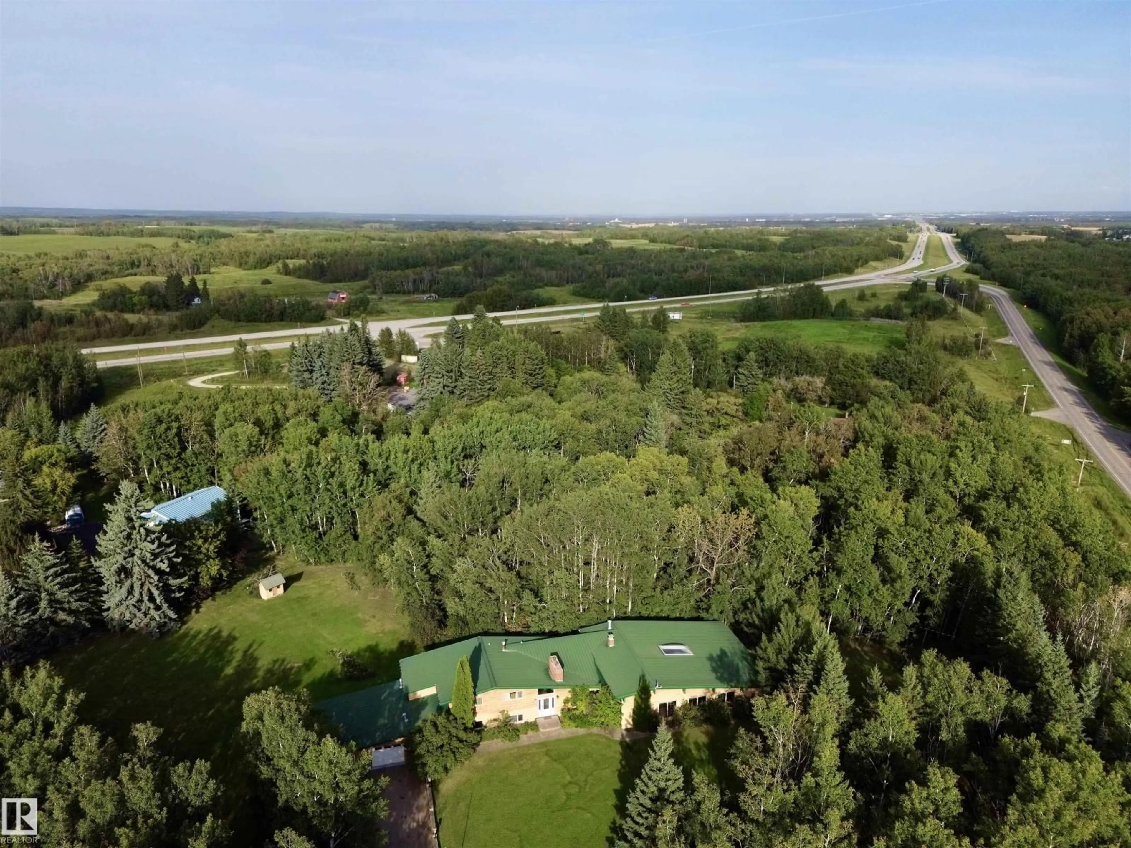 A pic from outside/outdoor area/front of a property/back of a property/a pic from drone, forest/trees view for 53001 RGE ROAD 14, Rural Parkland County Alberta T0E0H0