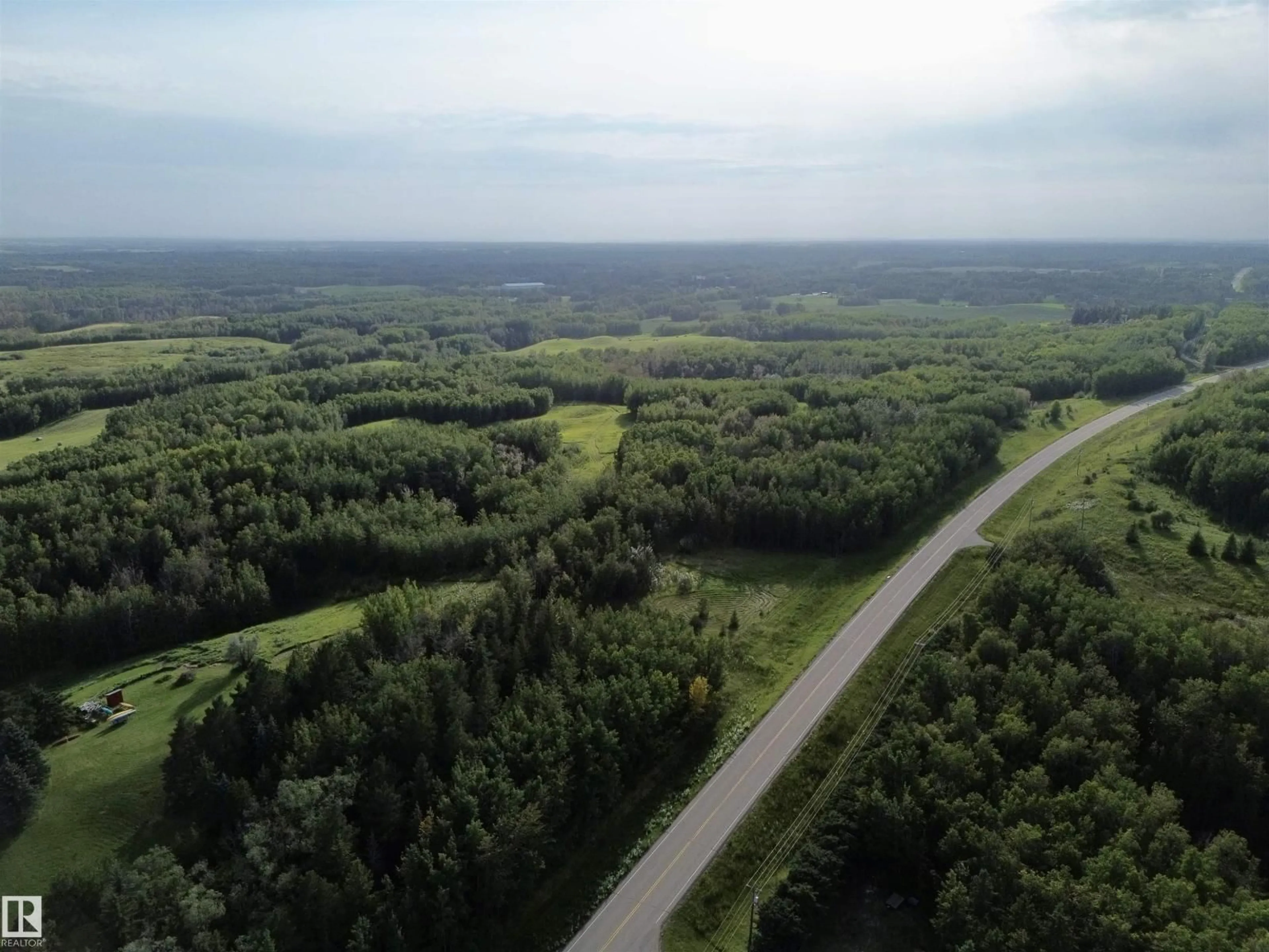 A pic from outside/outdoor area/front of a property/back of a property/a pic from drone, forest/trees view for 53001 RGE ROAD 14, Rural Parkland County Alberta T0E0H0