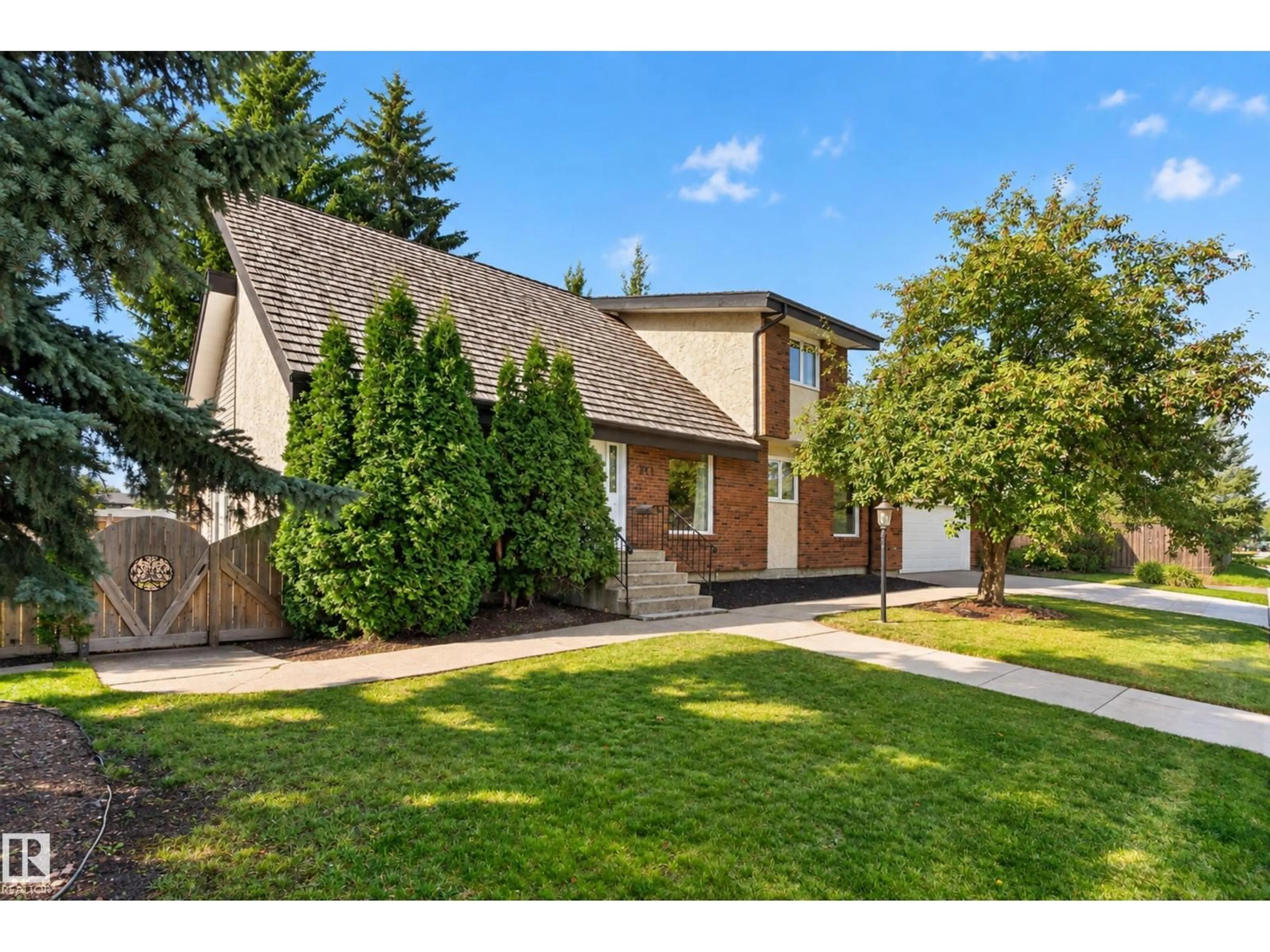 Home with brick exterior material, street for 311 LESSARD DR, Edmonton Alberta T6M1A6