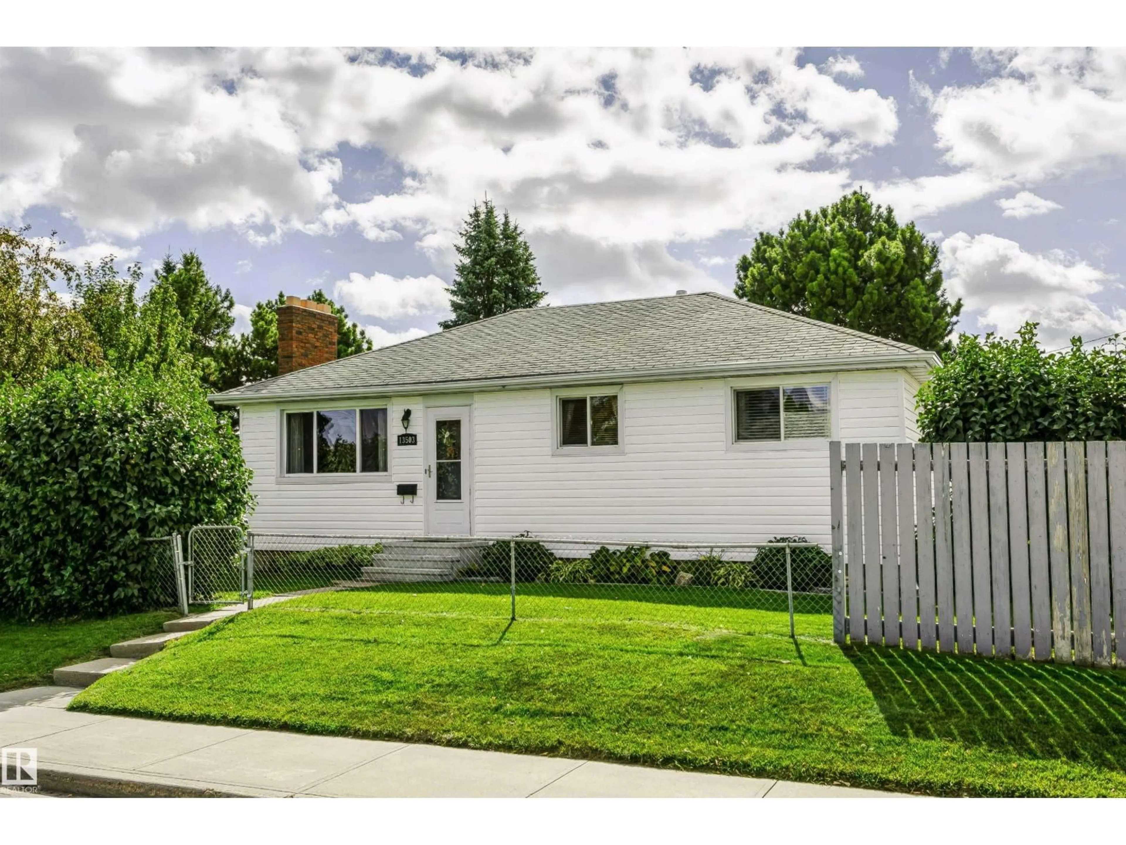 Home with vinyl exterior material, street for 13503 135 AV, Edmonton Alberta T5L3Y4