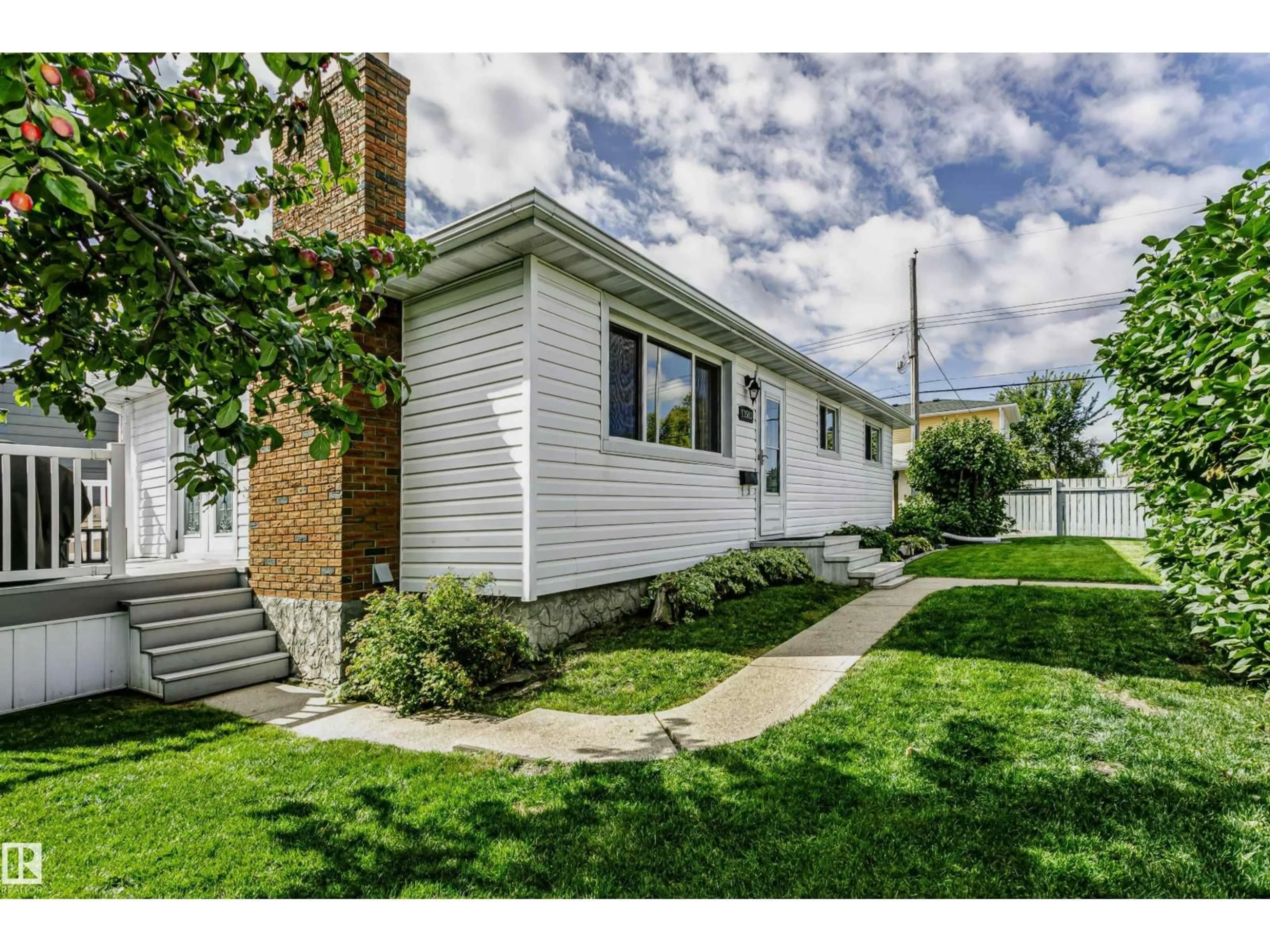 Home with vinyl exterior material, street for 13503 135 AV, Edmonton Alberta T5L3Y4