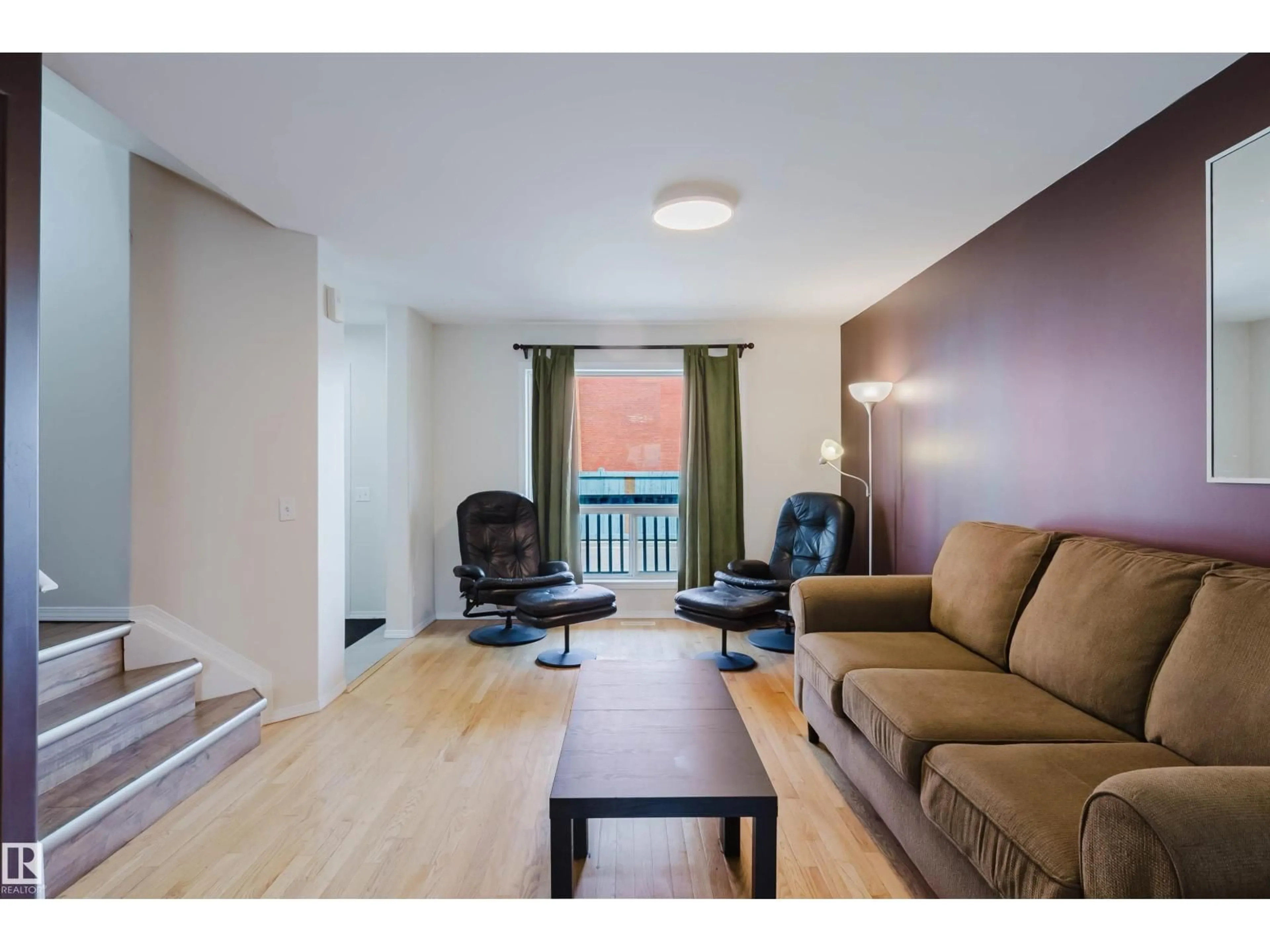 Living room with furniture, wood/laminate floor for 66 - 10909 106 ST NW, Edmonton Alberta T5H4M7