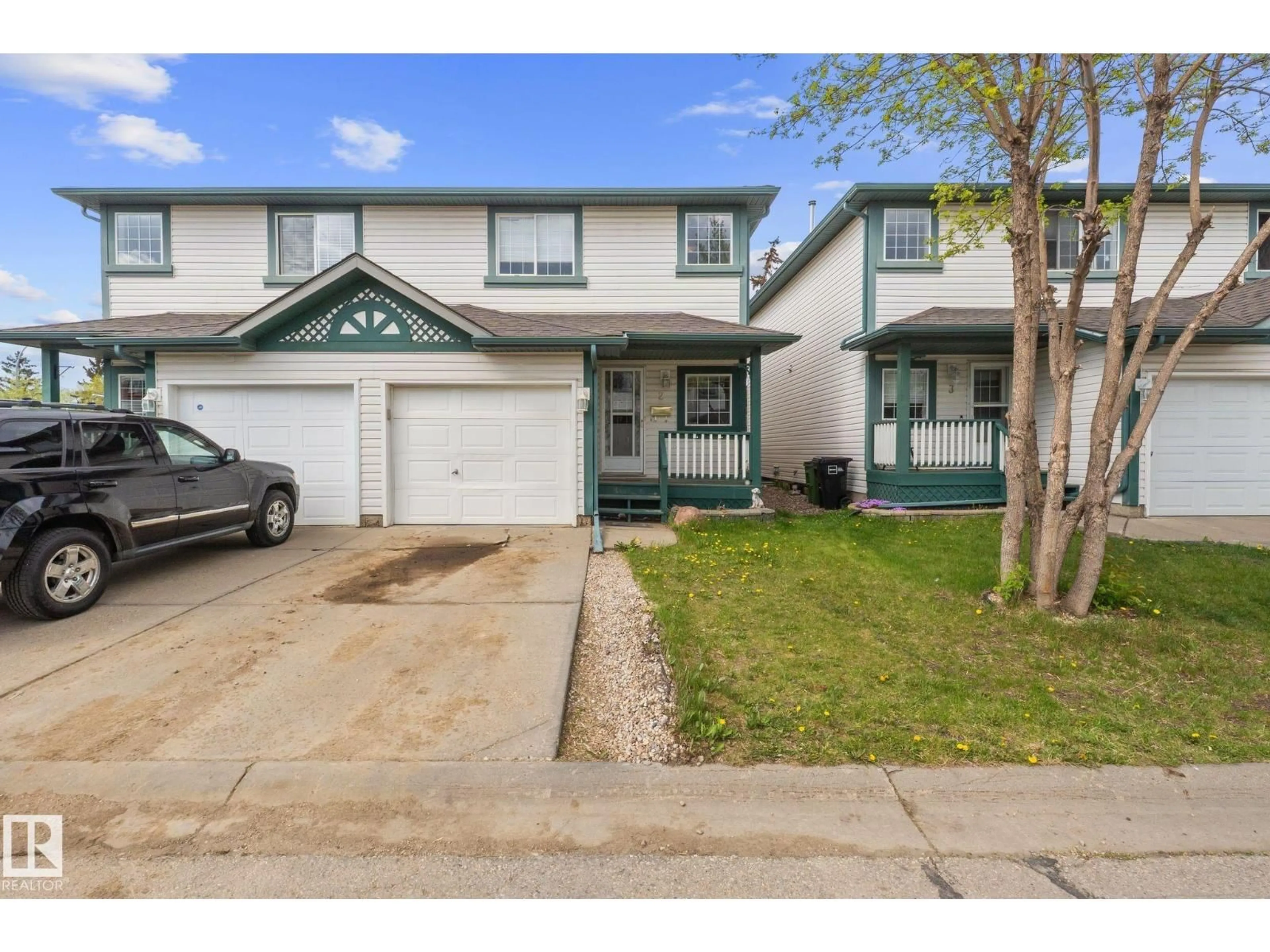 Home with vinyl exterior material, street for #2 - 15215 126 ST, Edmonton Alberta T5X5Z3