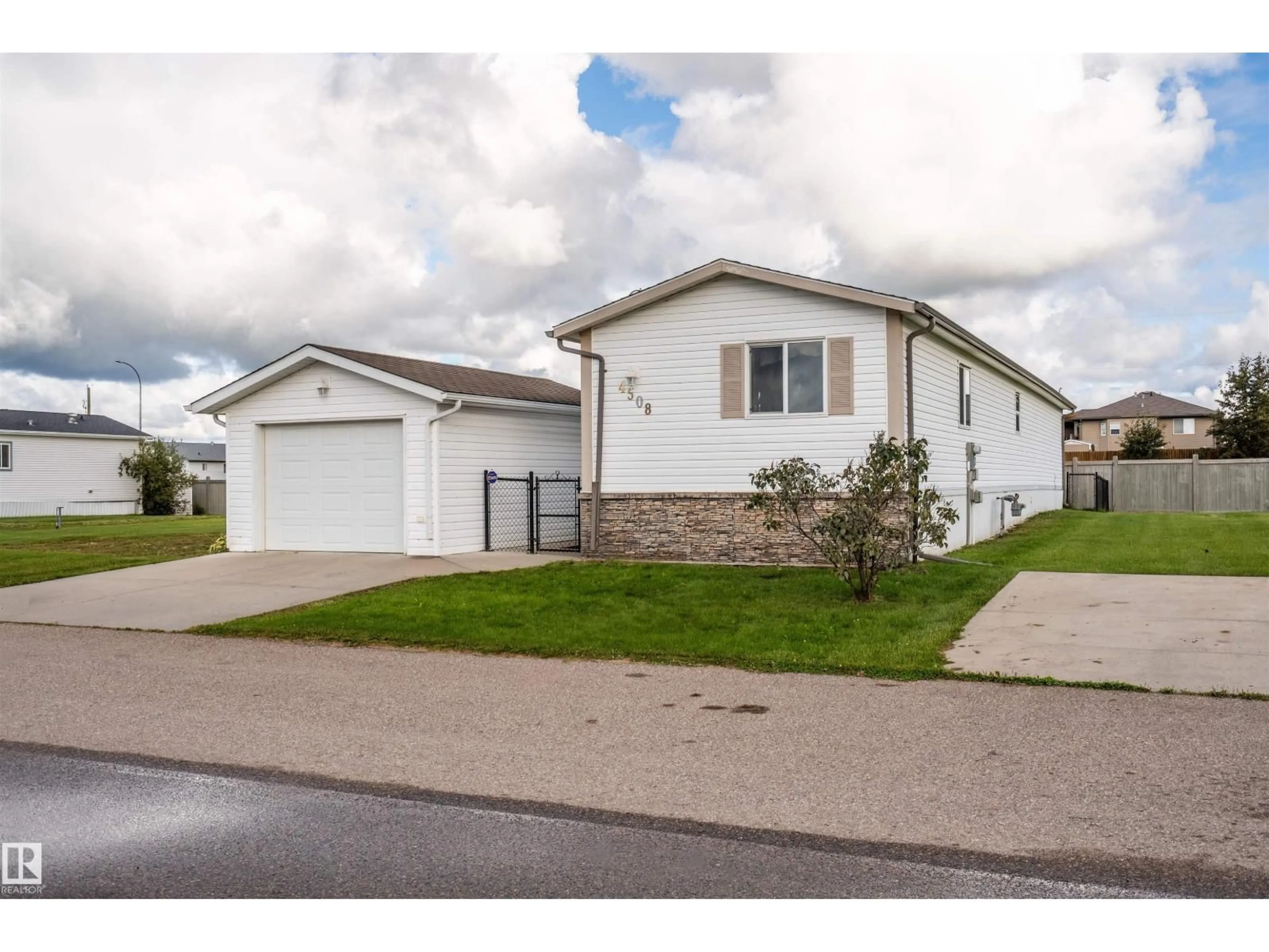 Home with vinyl exterior material, street for 4508 LABRADOR RD, Cold Lake Alberta T9M0C6