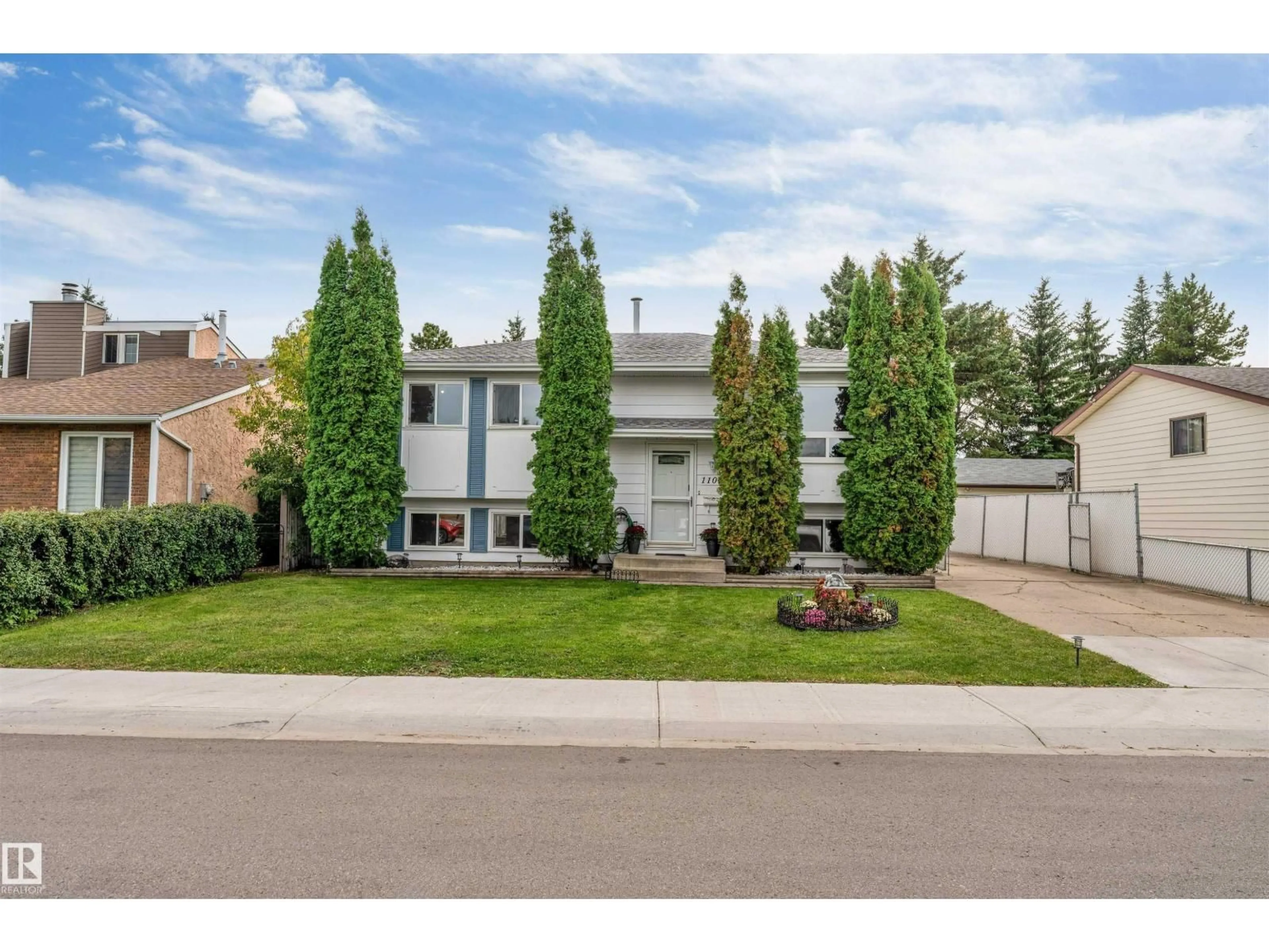 Home with vinyl exterior material, street for NW - 11015 170 AV, Edmonton Alberta T5X3L1