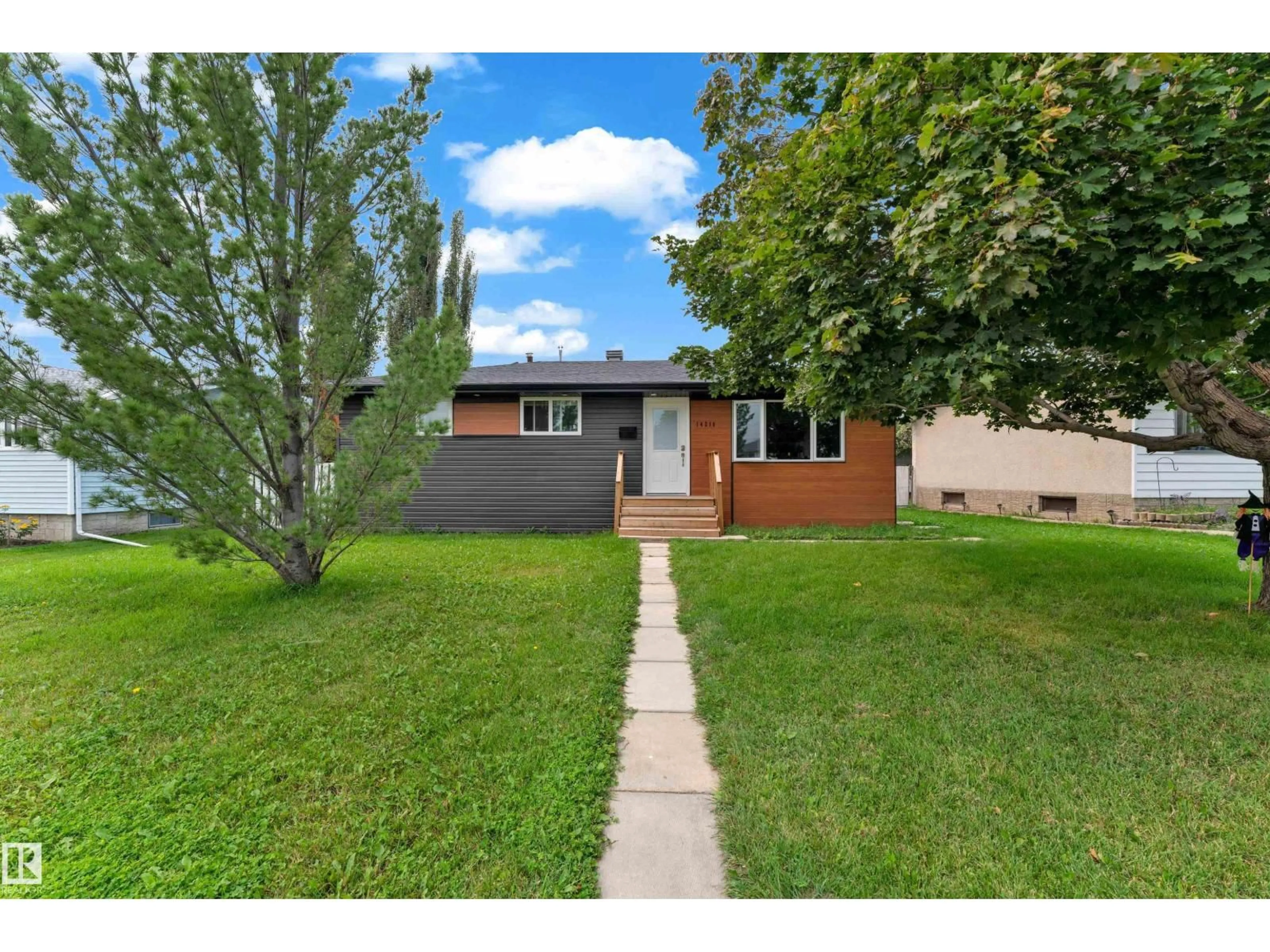 Home with vinyl exterior material, street for NW - 14216 58 ST, Edmonton Alberta T5A1N4