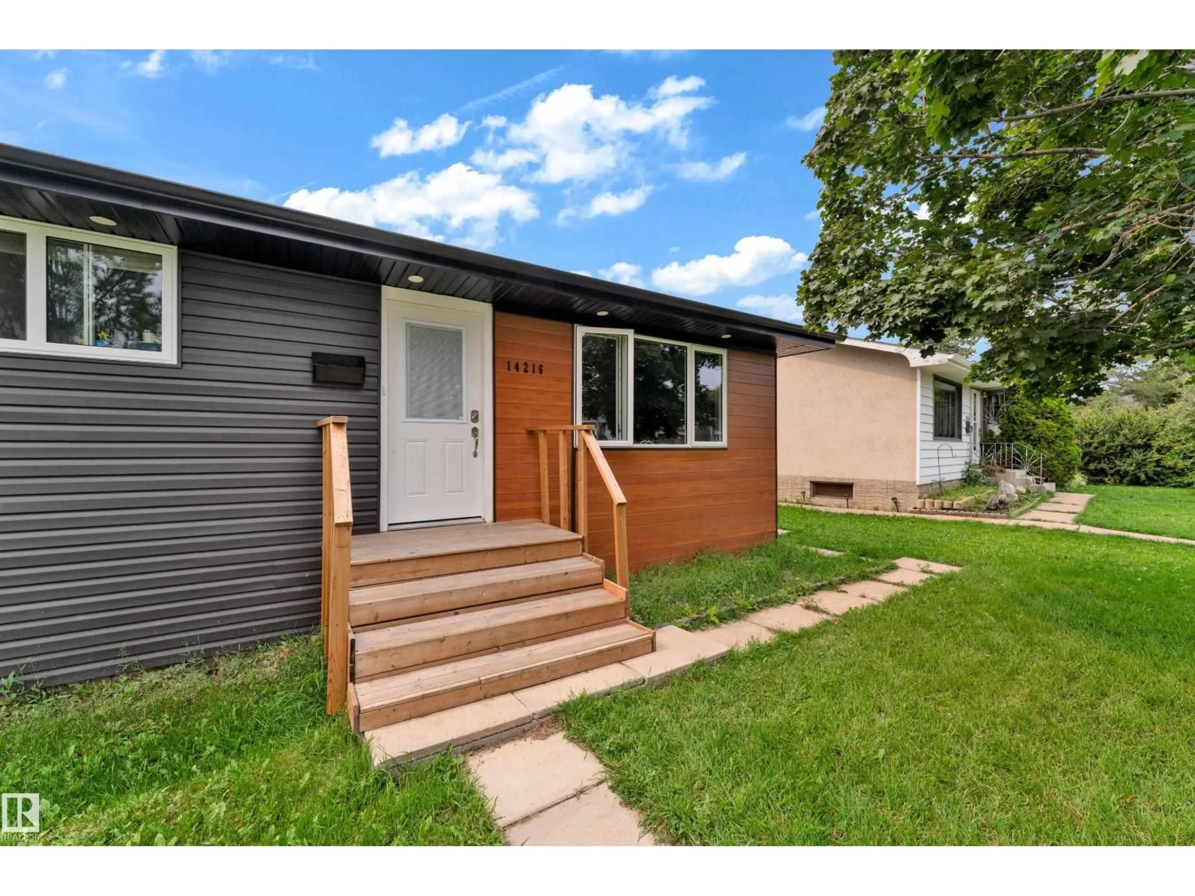 Home with vinyl exterior material, street for NW - 14216 58 ST, Edmonton Alberta T5A1N4