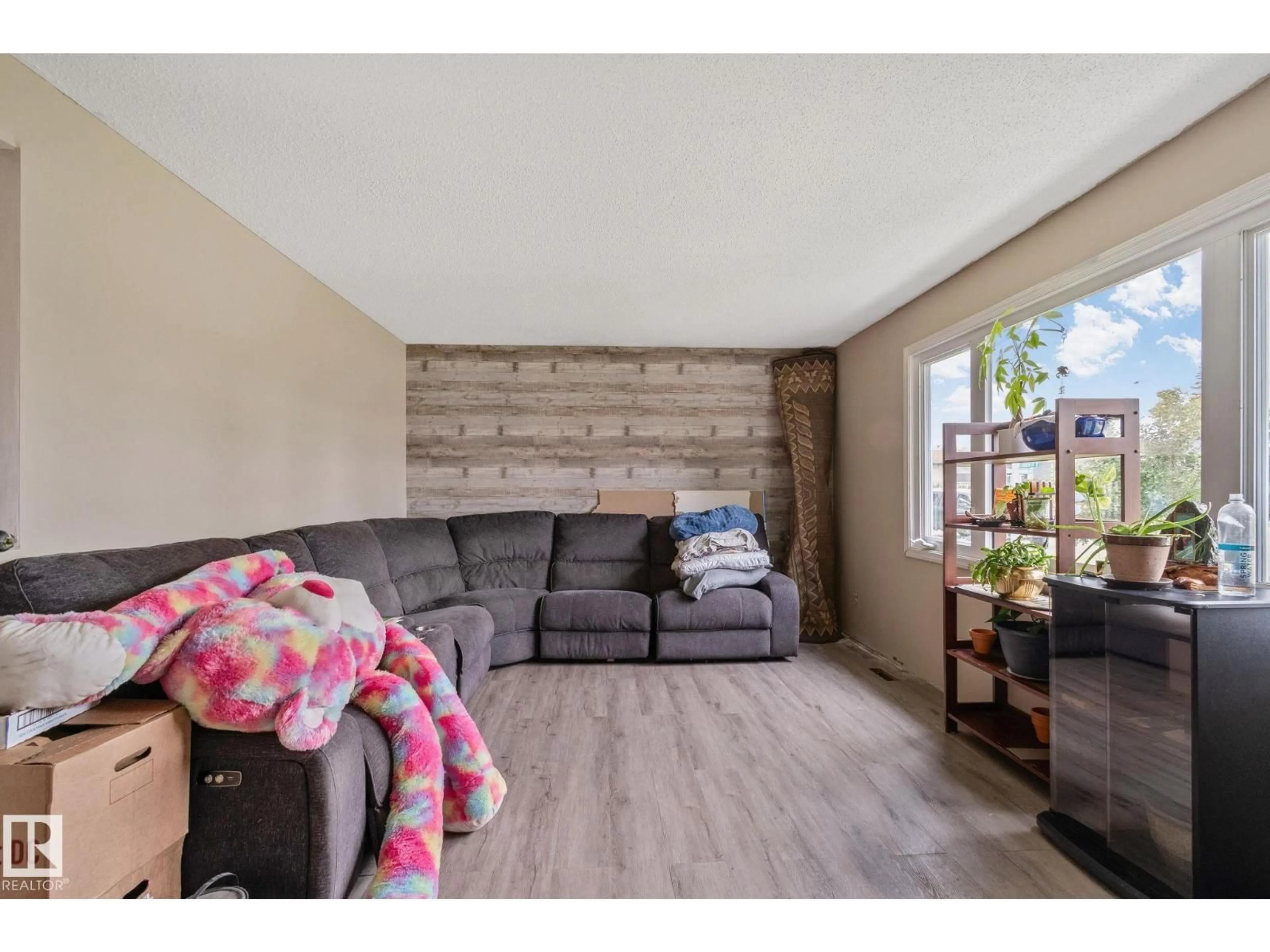 Living room with furniture, wood/laminate floor for 31 LINDEN ST, Spruce Grove Alberta T7X2G5