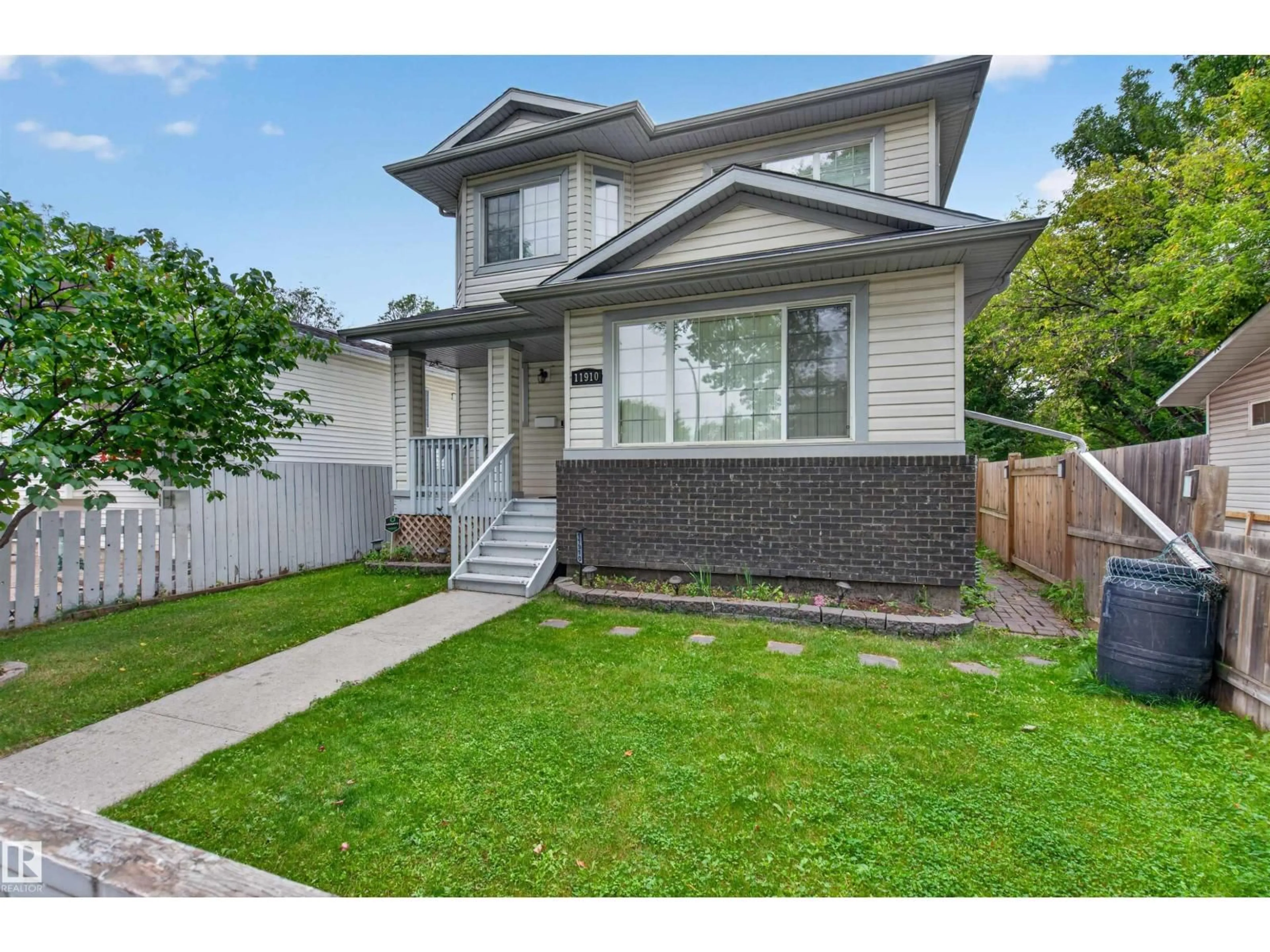 Home with vinyl exterior material, street for 11910 93 ST, Edmonton Alberta T5G1E5