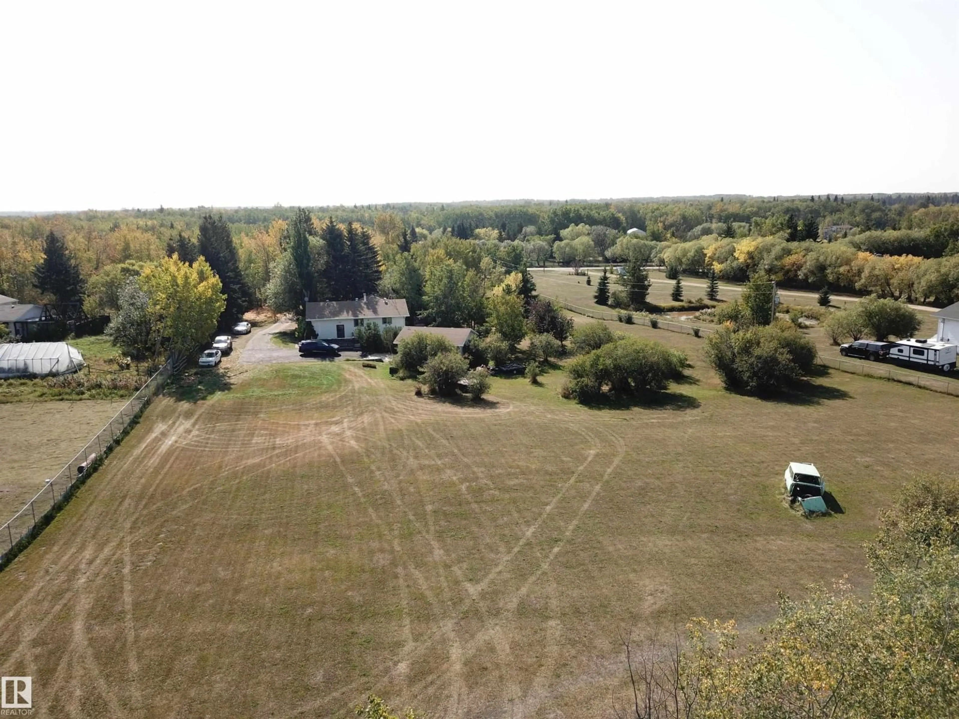 A pic from outside/outdoor area/front of a property/back of a property/a pic from drone, forest/trees view for 390 50448 RG RD RD, Rural Leduc County Alberta T0B3M2