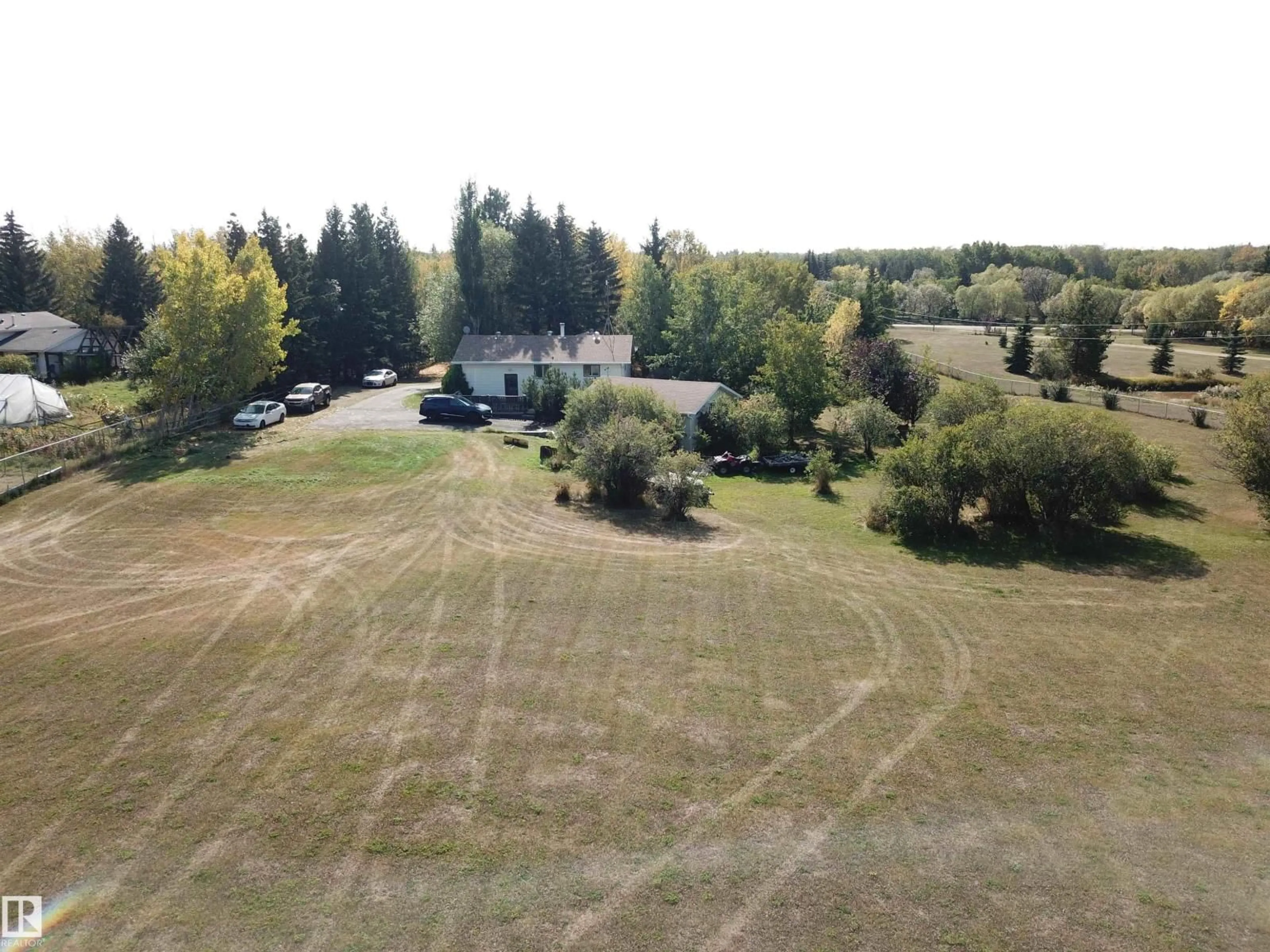 A pic from outside/outdoor area/front of a property/back of a property/a pic from drone, forest/trees view for 390 50448 RG RD RD, Rural Leduc County Alberta T0B3M2