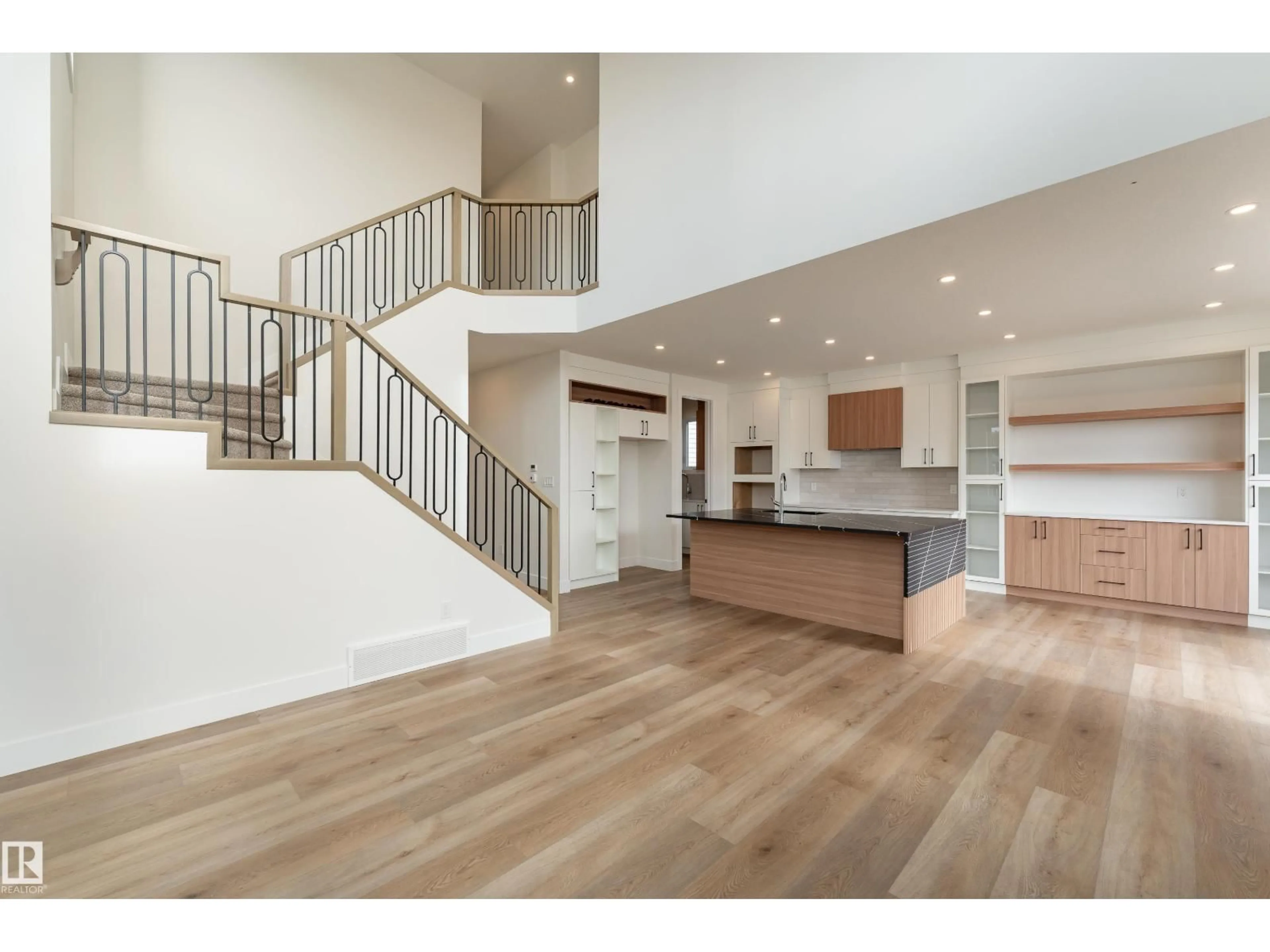 Open concept kitchen, wood/laminate floor for 84 MAPLE CR, Gibbons Alberta T0A1N0