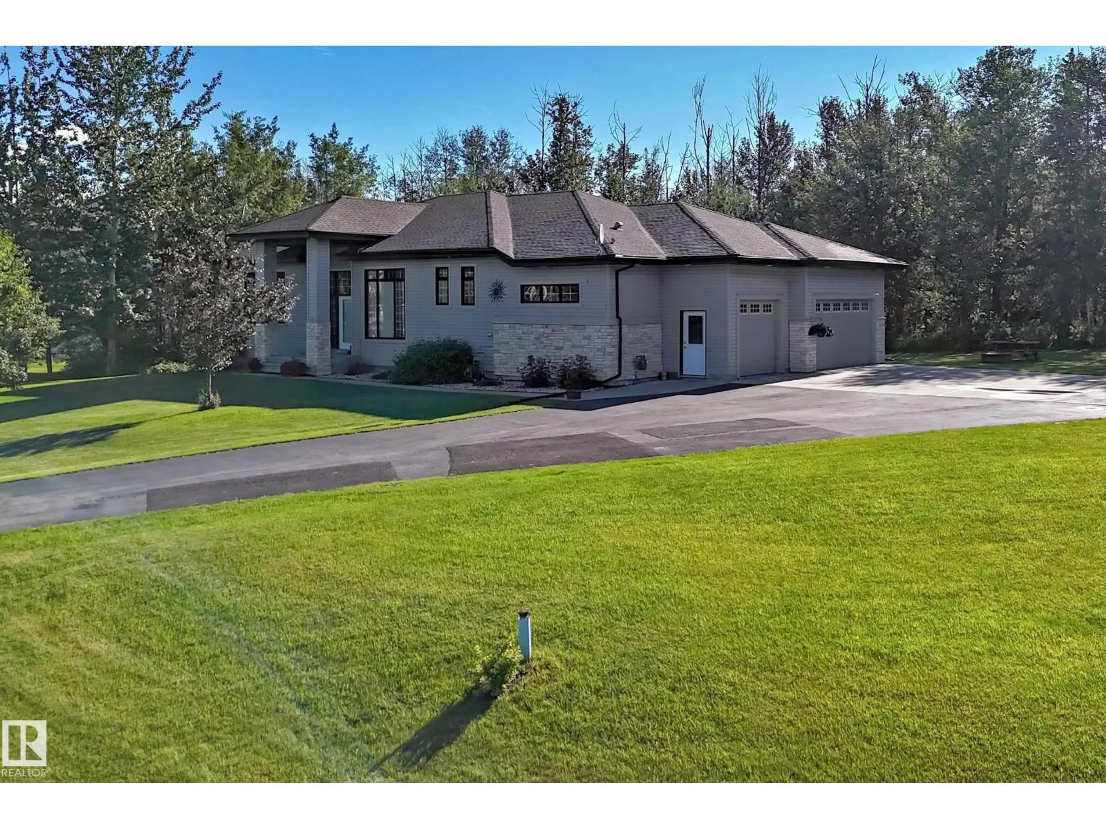 A pic from outside/outdoor area/front of a property/back of a property/a pic from drone, street for #7 - 53216 RGE ROAD 264 RGE ROAD, Rural Parkland County Alberta T7Y1A4