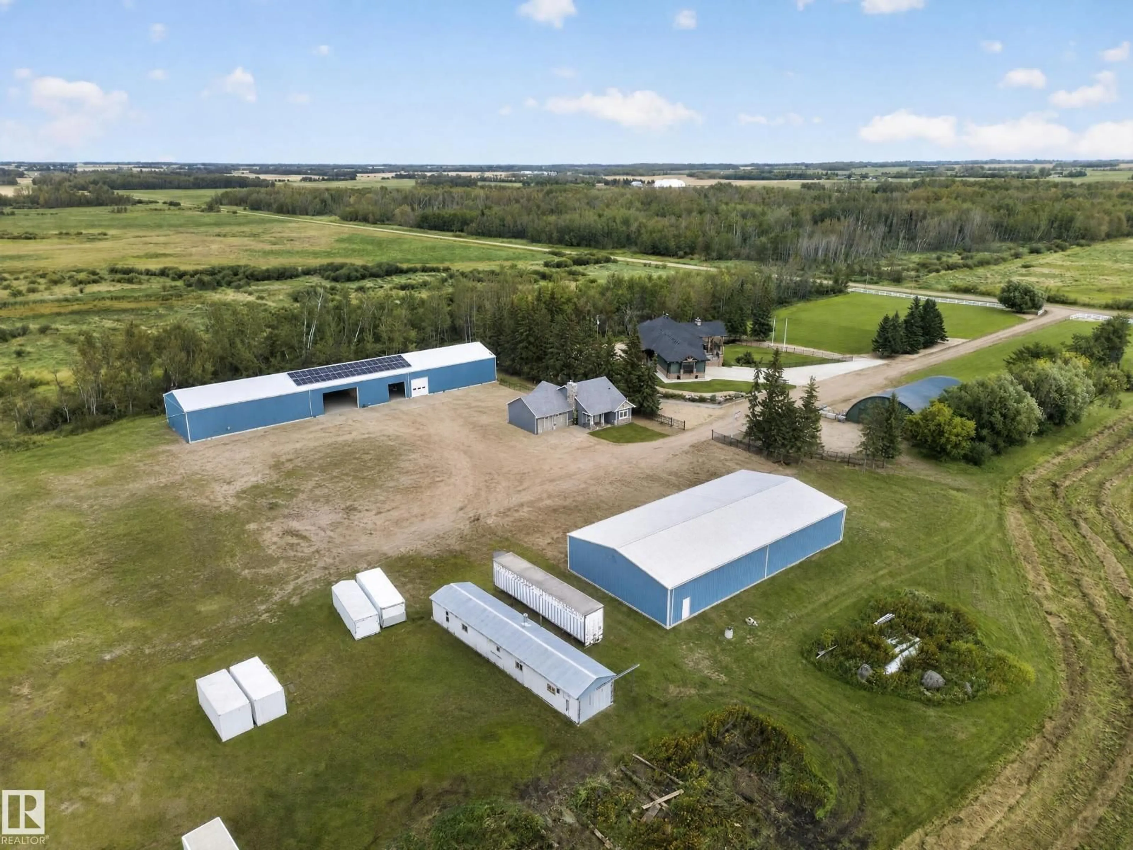 A pic from outside/outdoor area/front of a property/back of a property/a pic from drone, building for 58316 RR 221, Rural Thorhild County Alberta T0A3J0