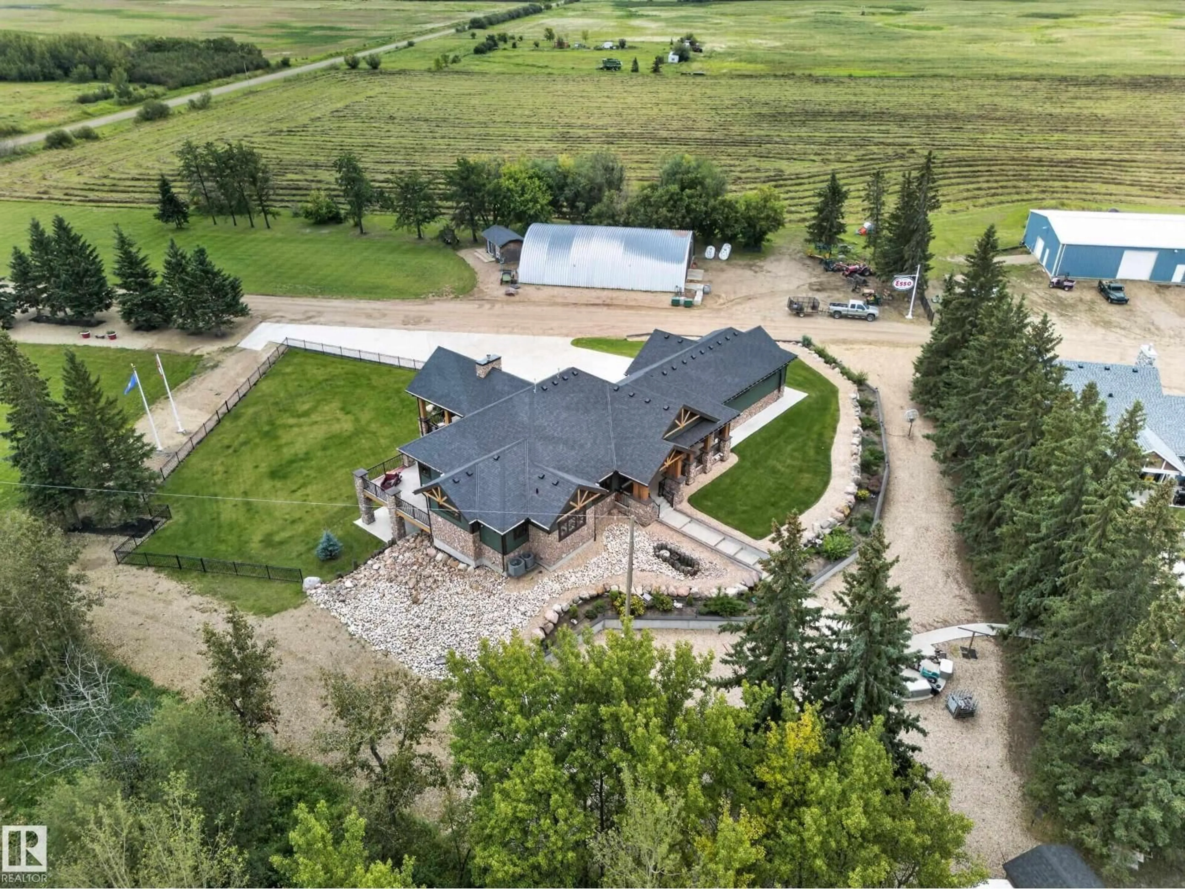 A pic from outside/outdoor area/front of a property/back of a property/a pic from drone, mountain view for 58316 RR 221, Rural Thorhild County Alberta T0A3J0