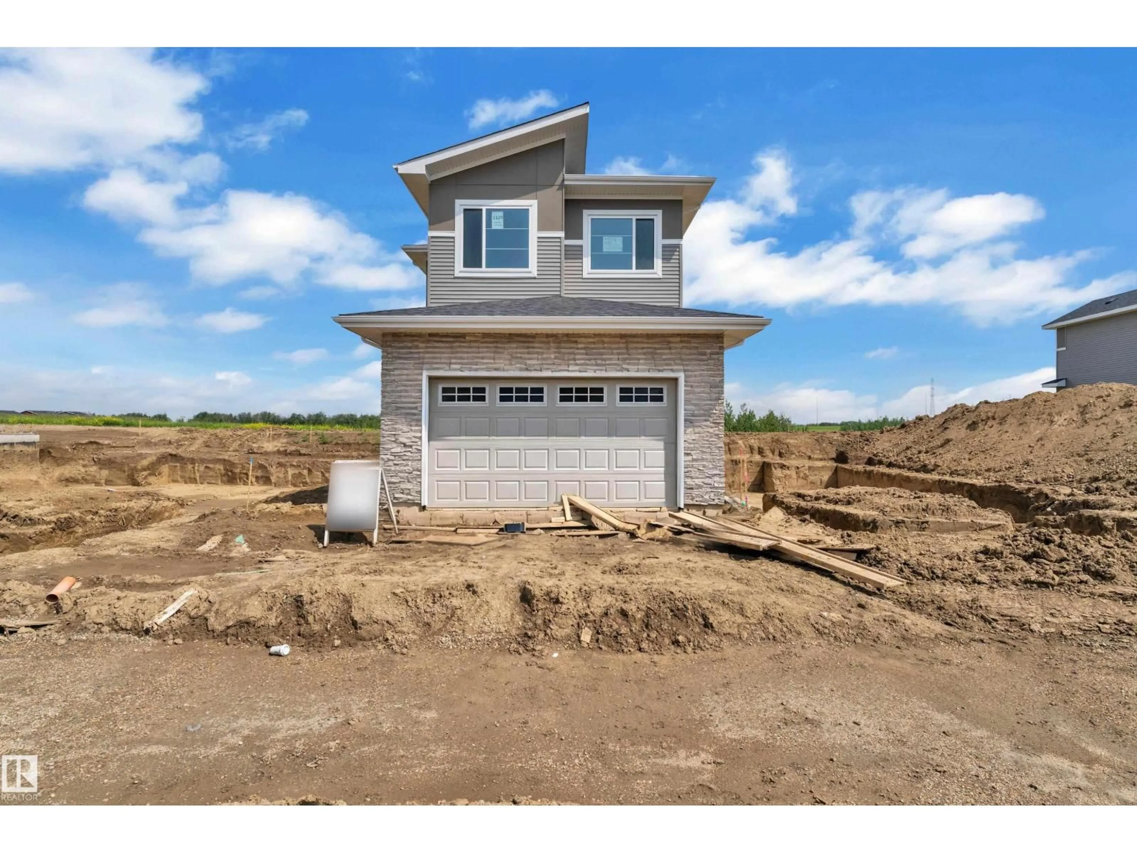 Home with vinyl exterior material, street for 1129 STARLING DR, Edmonton Alberta T5S0X9