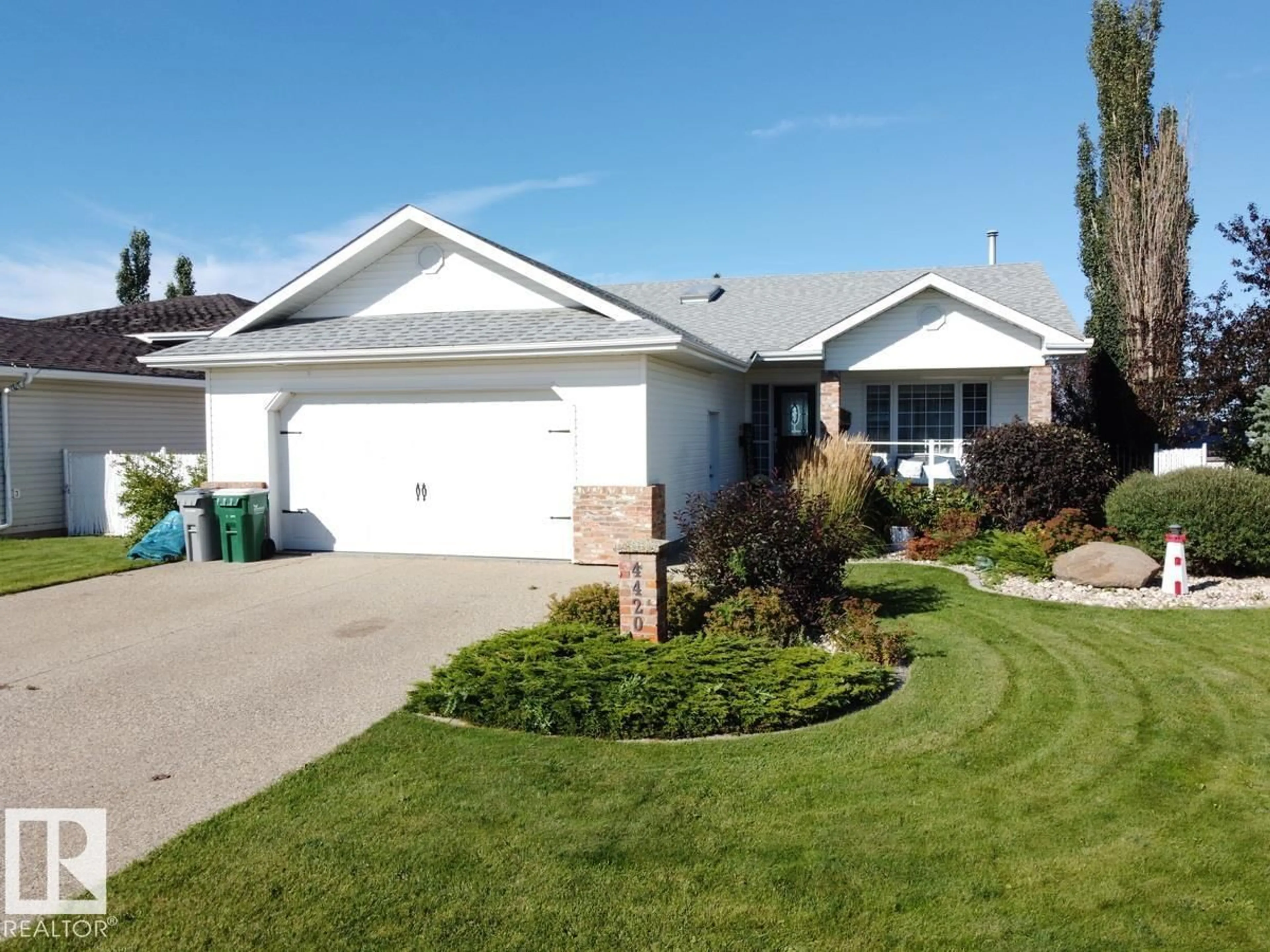 Home with vinyl exterior material, street for 4420 56 AV, Lamont Alberta T0B2R0