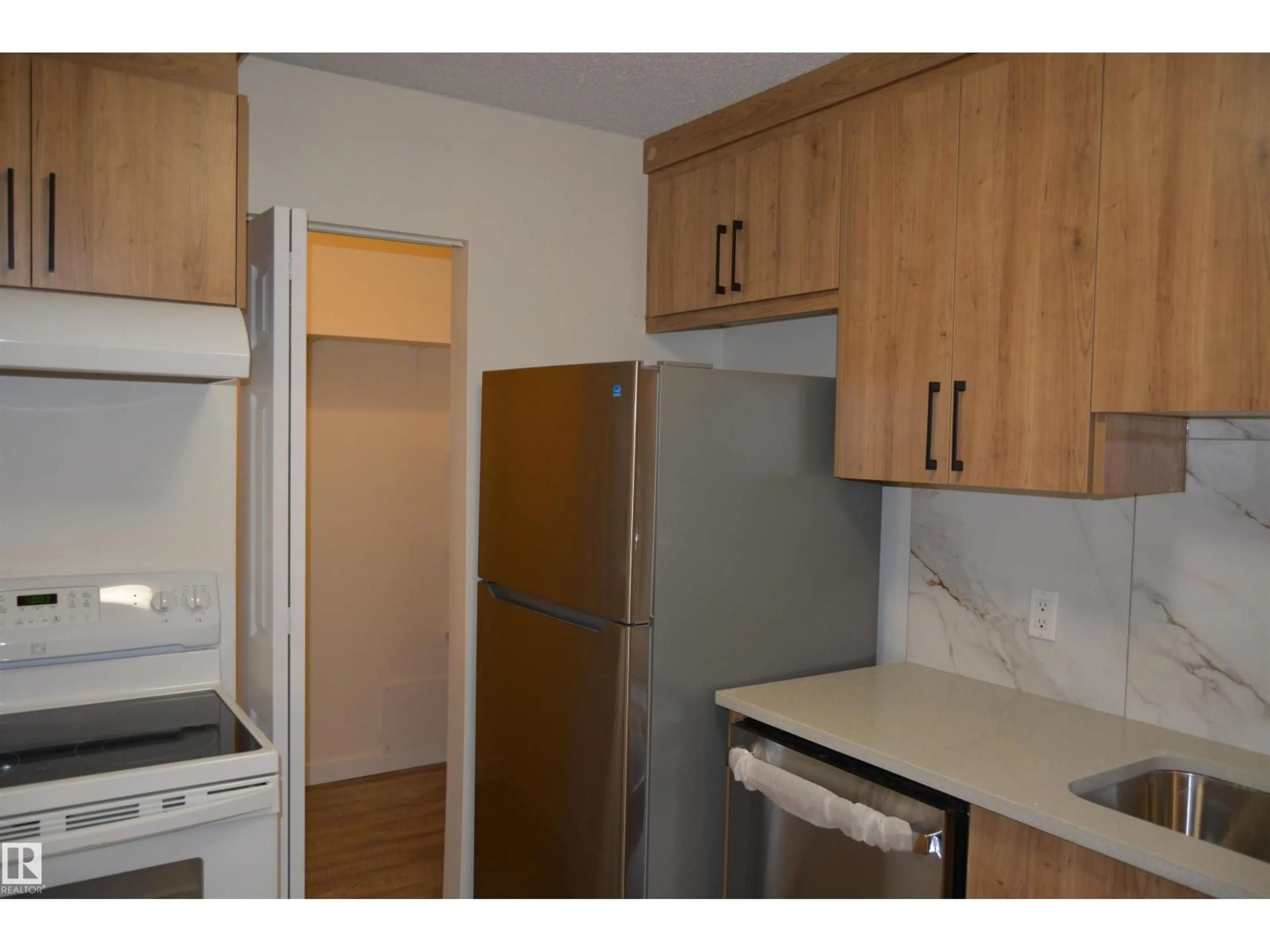 Standard kitchen, wood/laminate floor for 49 - 1503 MILL WOODS RD E, Edmonton Alberta T6L4C2