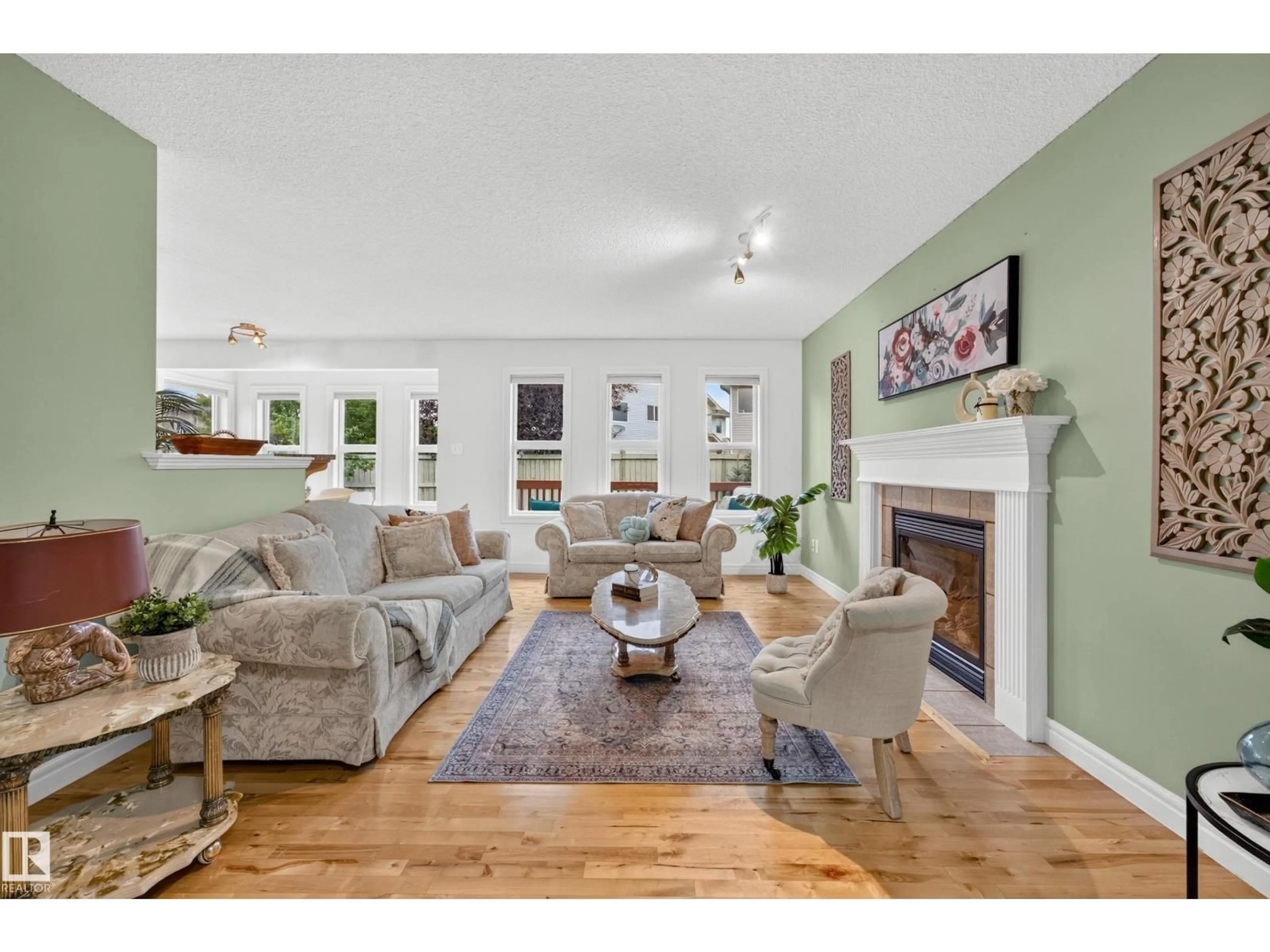 Living room with furniture, wood/laminate floor for 984 RUTHERFORD RD, Edmonton Alberta T6W1W9