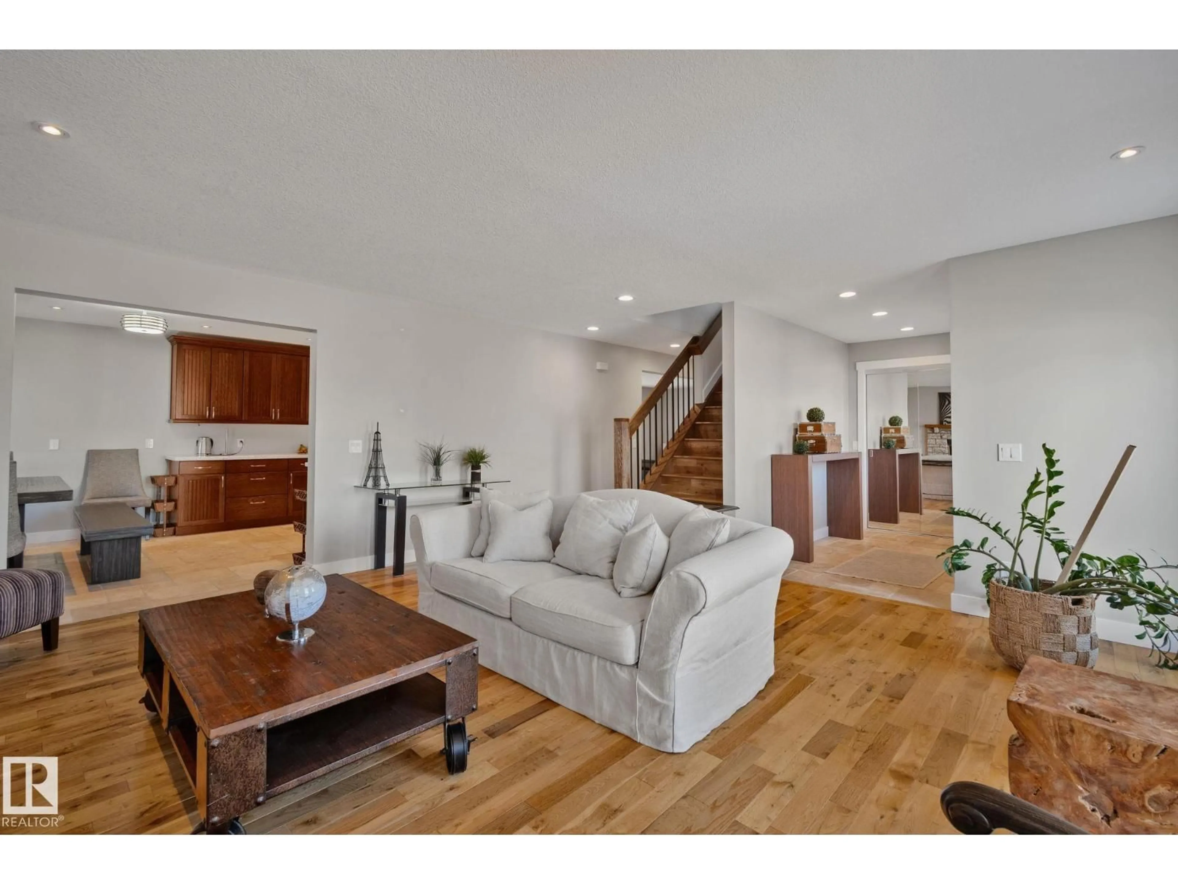 Living room with furniture, wood/laminate floor for 12403 29A AV, Edmonton Alberta T6J6C7