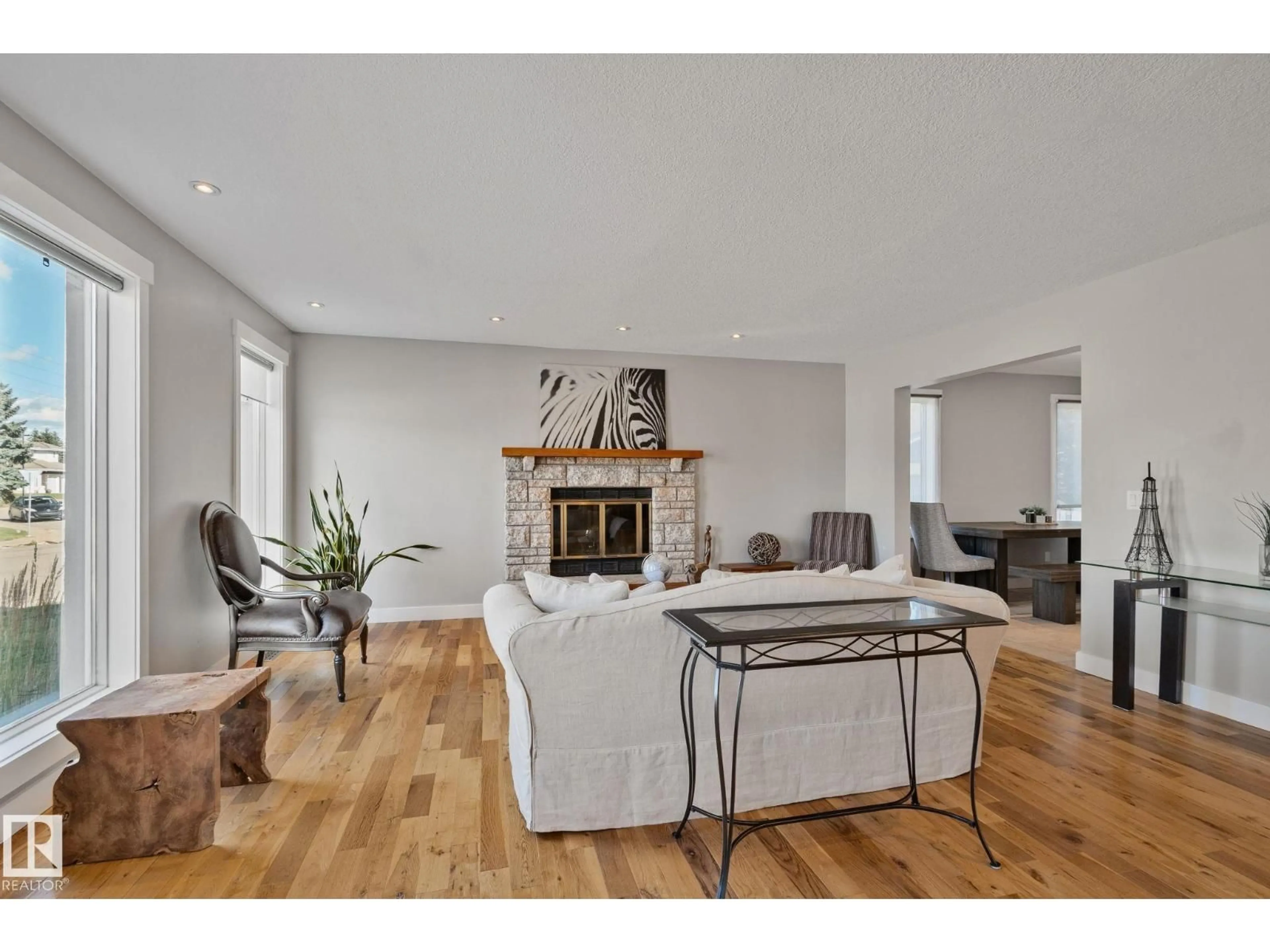 Living room with furniture, wood/laminate floor for 12403 29A AV, Edmonton Alberta T6J6C7