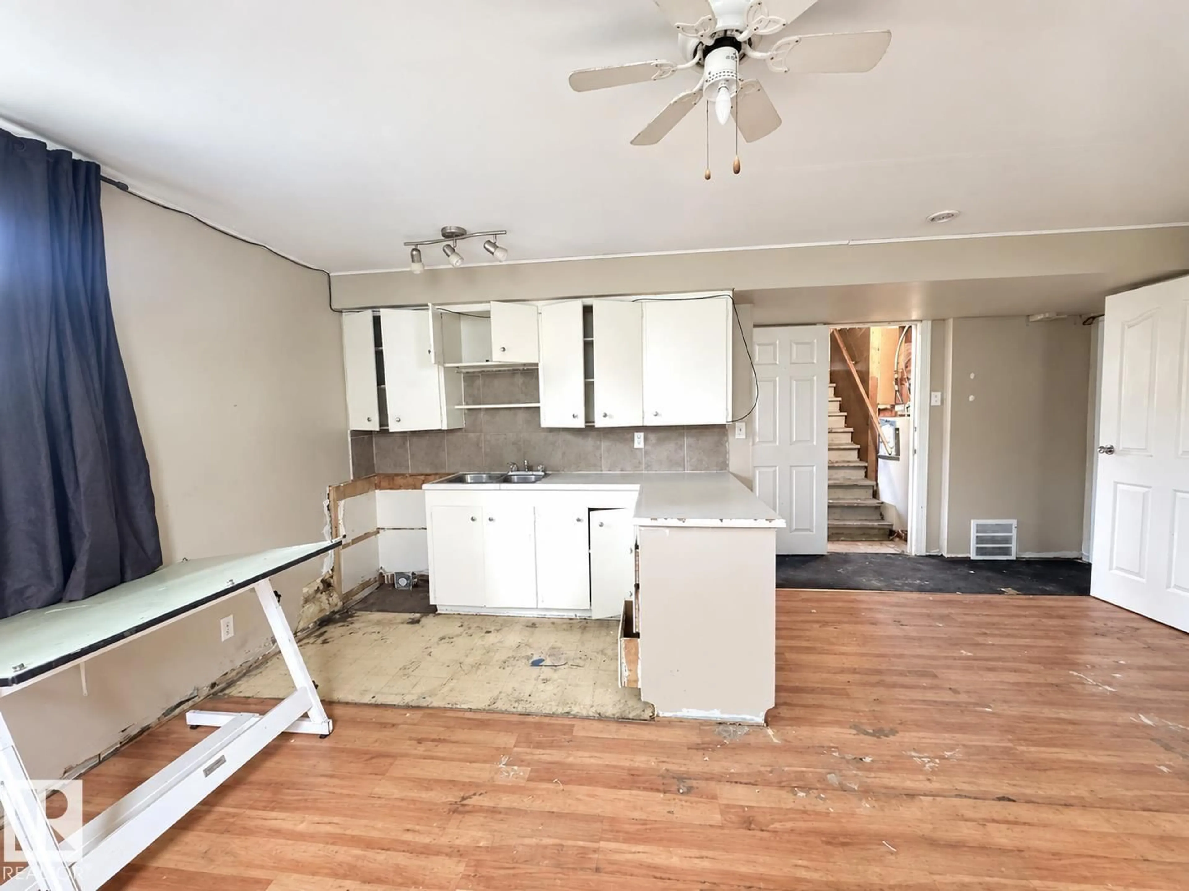 Open concept kitchen, wood/laminate floor for 12113 127 ST, Edmonton Alberta T5L0Z6