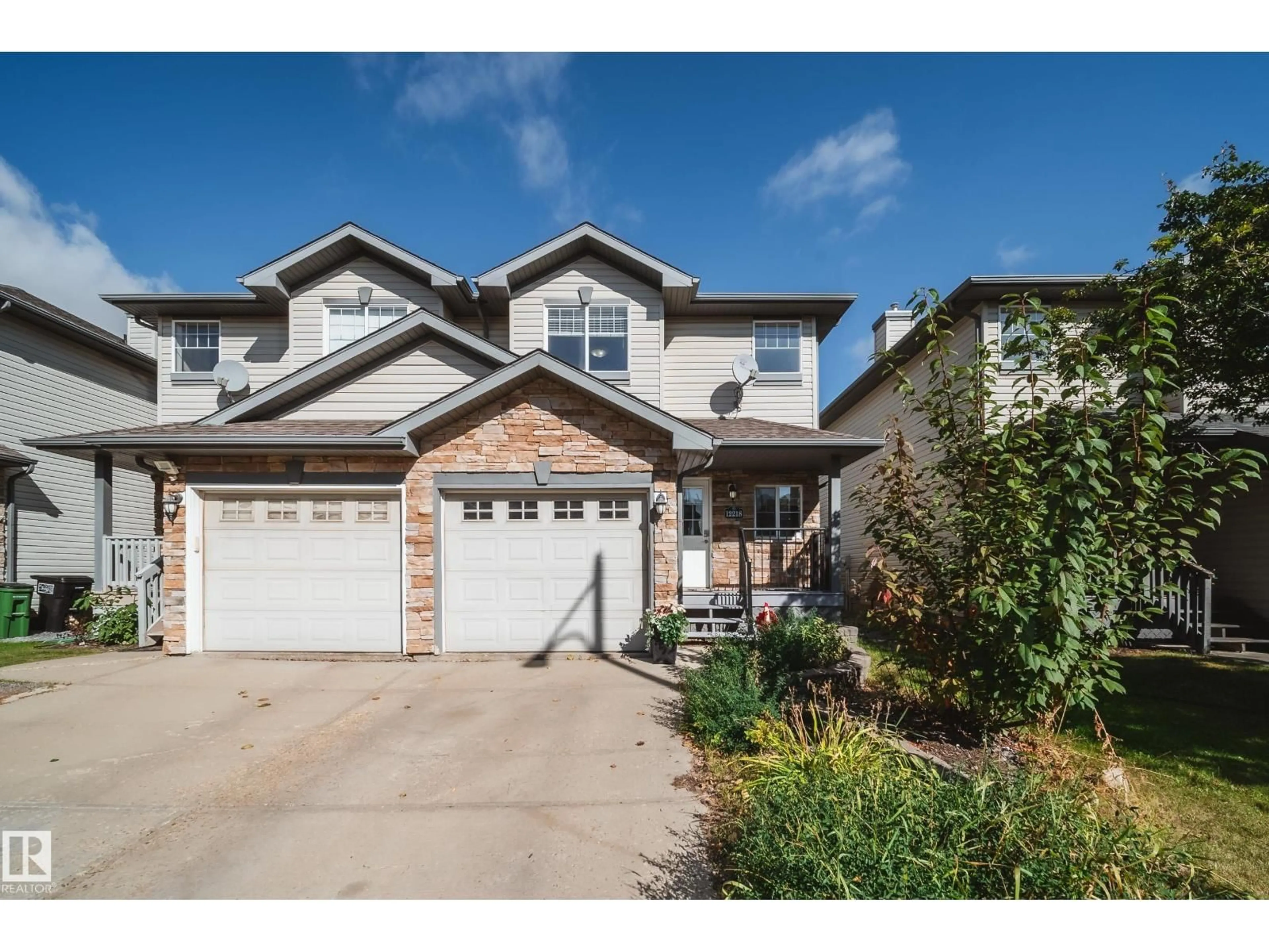 Home with vinyl exterior material, street for 12218 16 AV, Edmonton Alberta T6W1L7