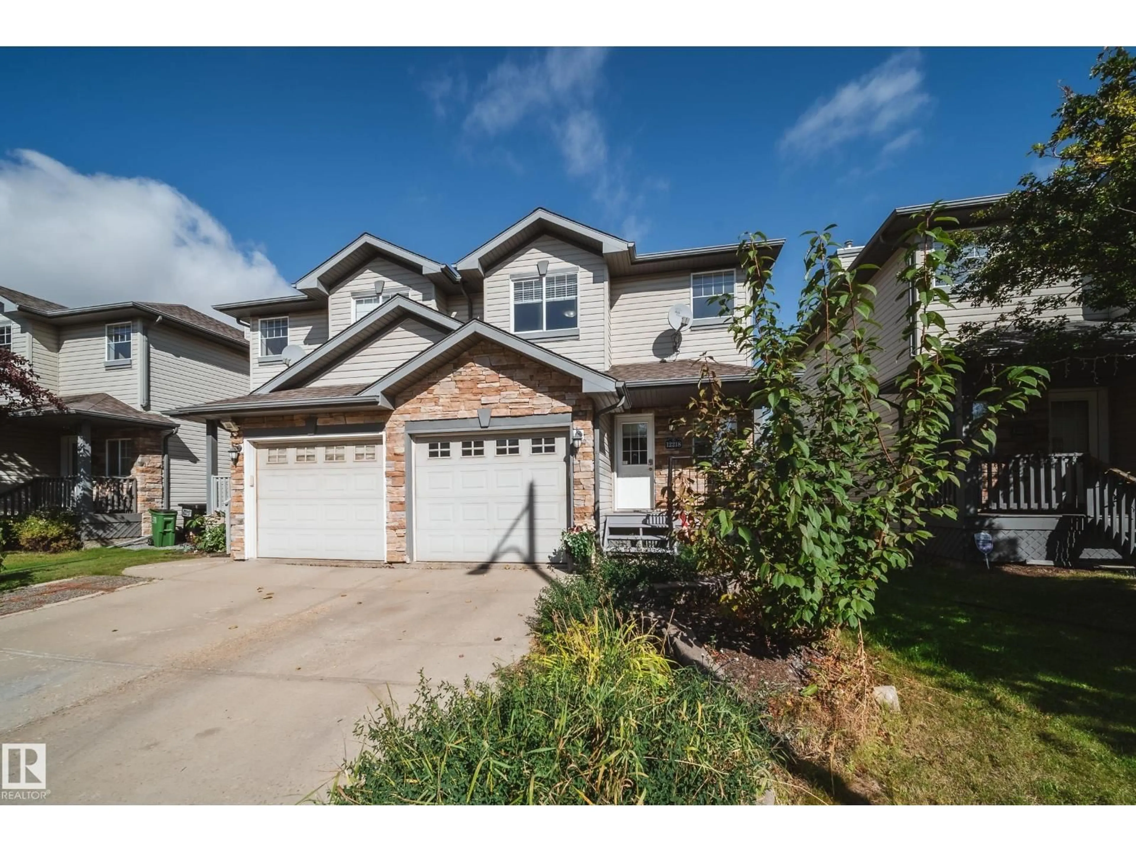 Home with vinyl exterior material, street for 12218 16 AV, Edmonton Alberta T6W1L7
