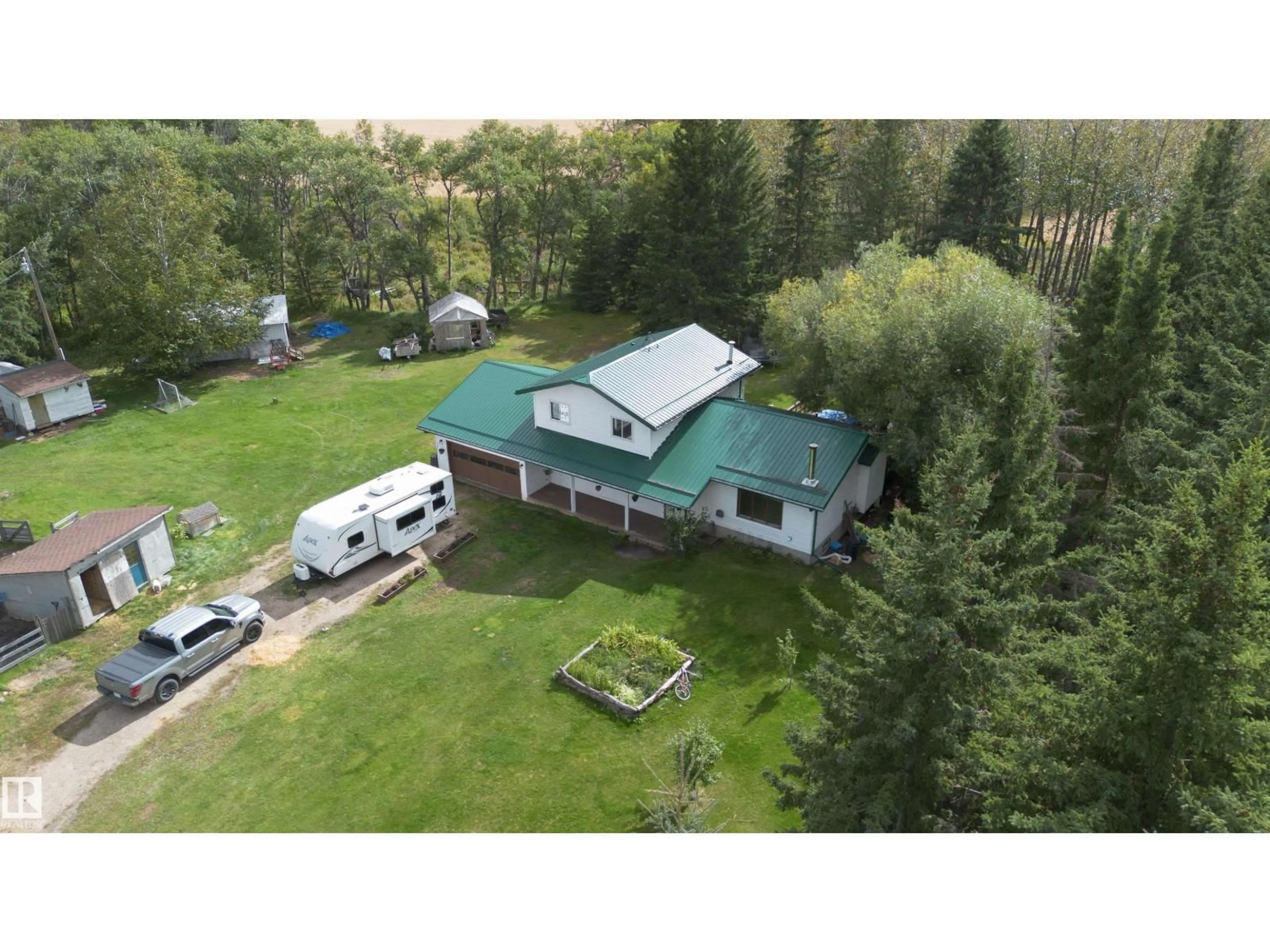 A pic from outside/outdoor area/front of a property/back of a property/a pic from drone, unknown for 50279 RGE RD 274, Rural Leduc County Alberta T0C0V0