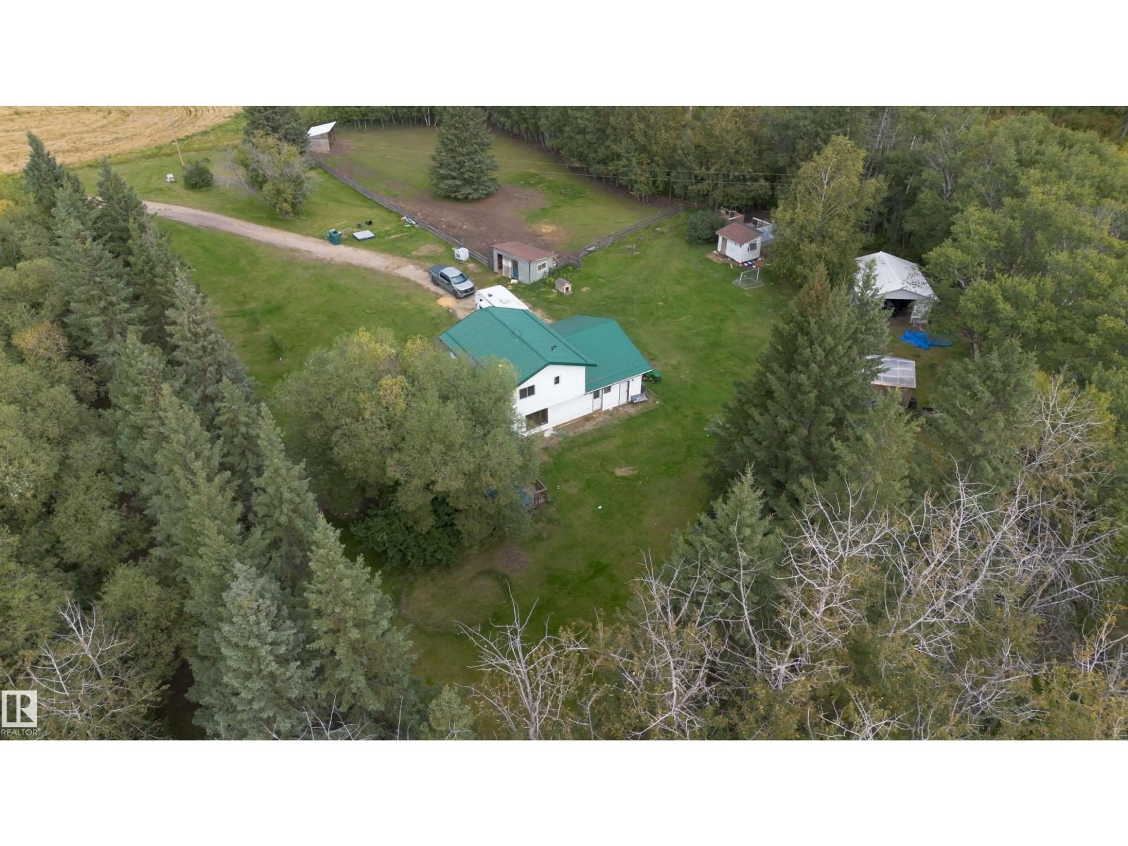 A pic from outside/outdoor area/front of a property/back of a property/a pic from drone, forest/trees view for 50279 RGE RD 274, Rural Leduc County Alberta T0C0V0