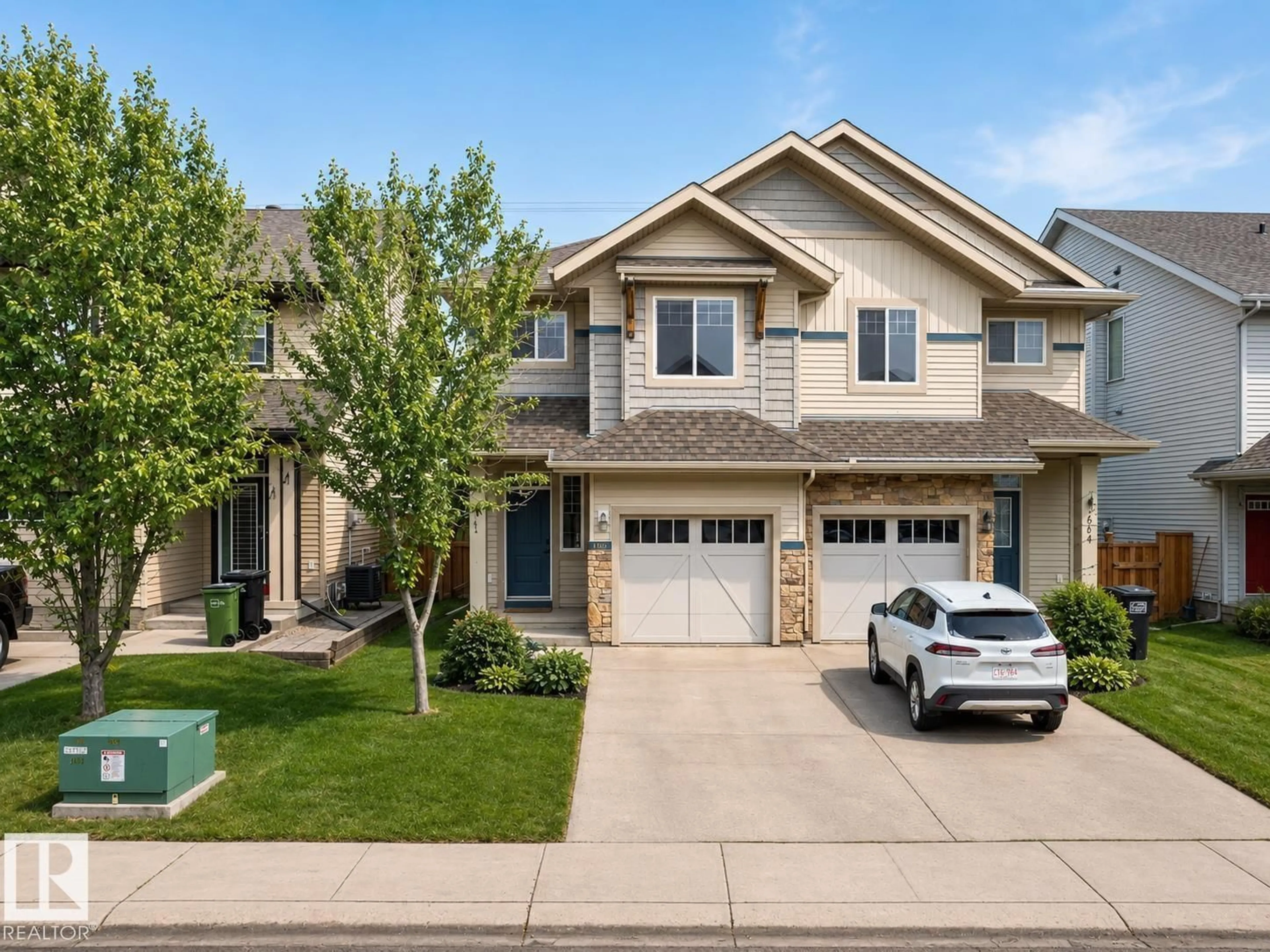 Home with vinyl exterior material, street for 1668 CHAPMAN WY, Edmonton Alberta T6W0Y5