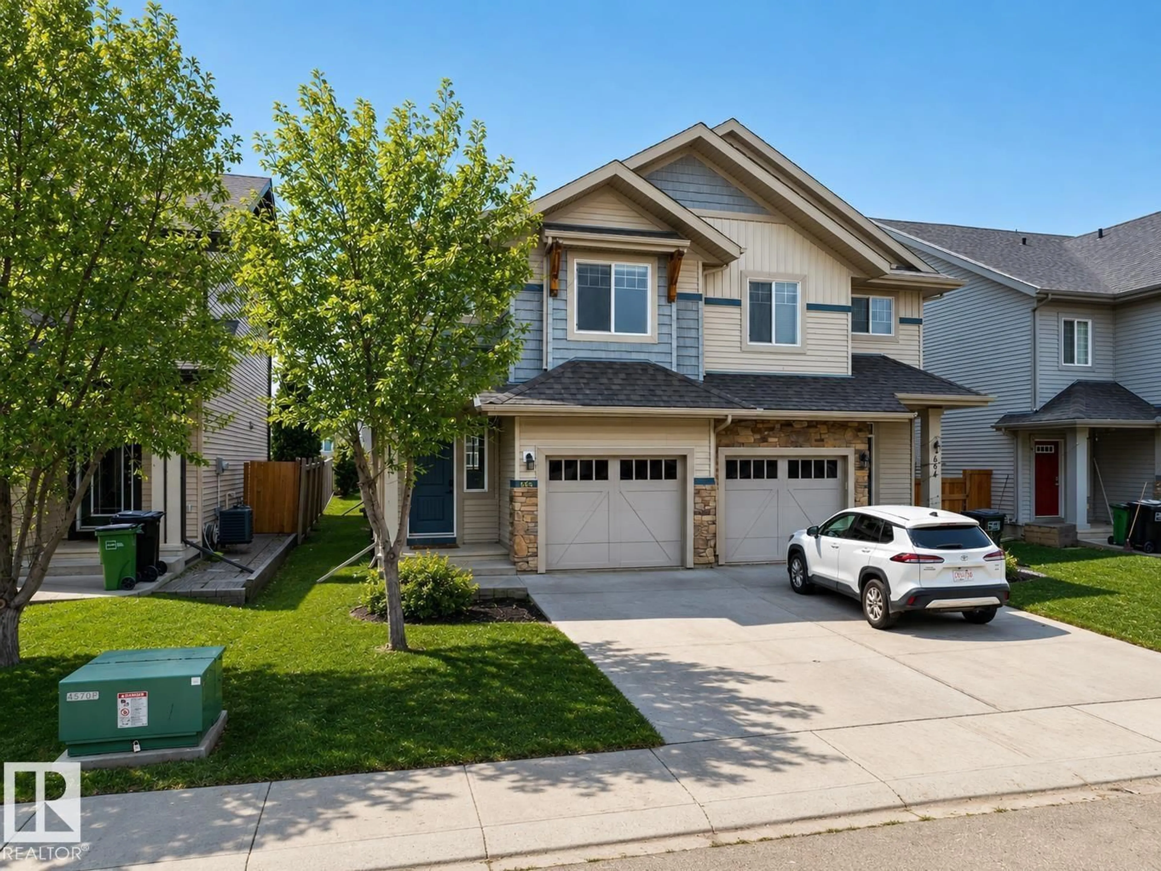 Home with vinyl exterior material, street for 1668 CHAPMAN WY, Edmonton Alberta T6W0Y5