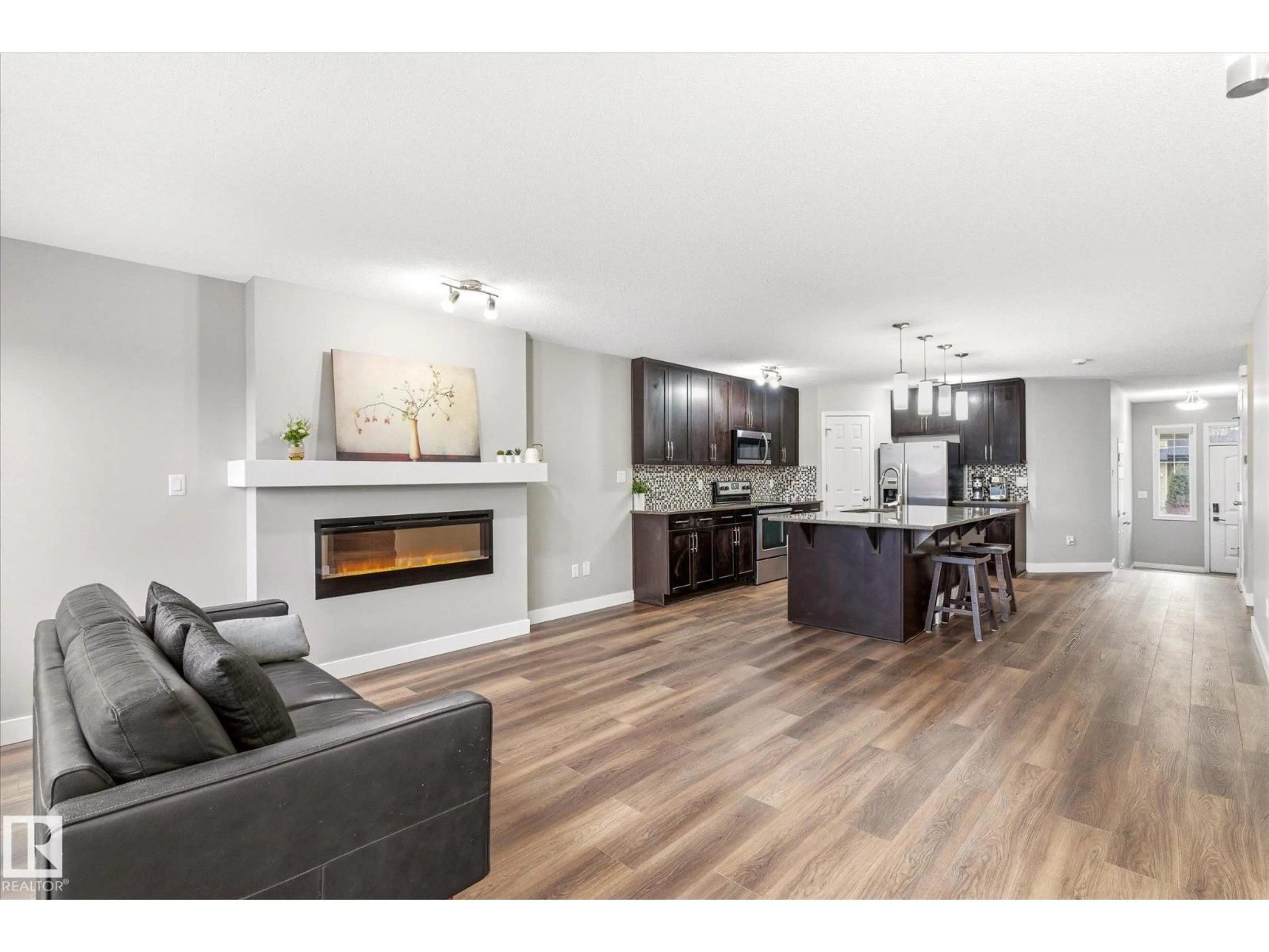 Open concept kitchen, wood/laminate floor for 1668 CHAPMAN WY, Edmonton Alberta T6W0Y5