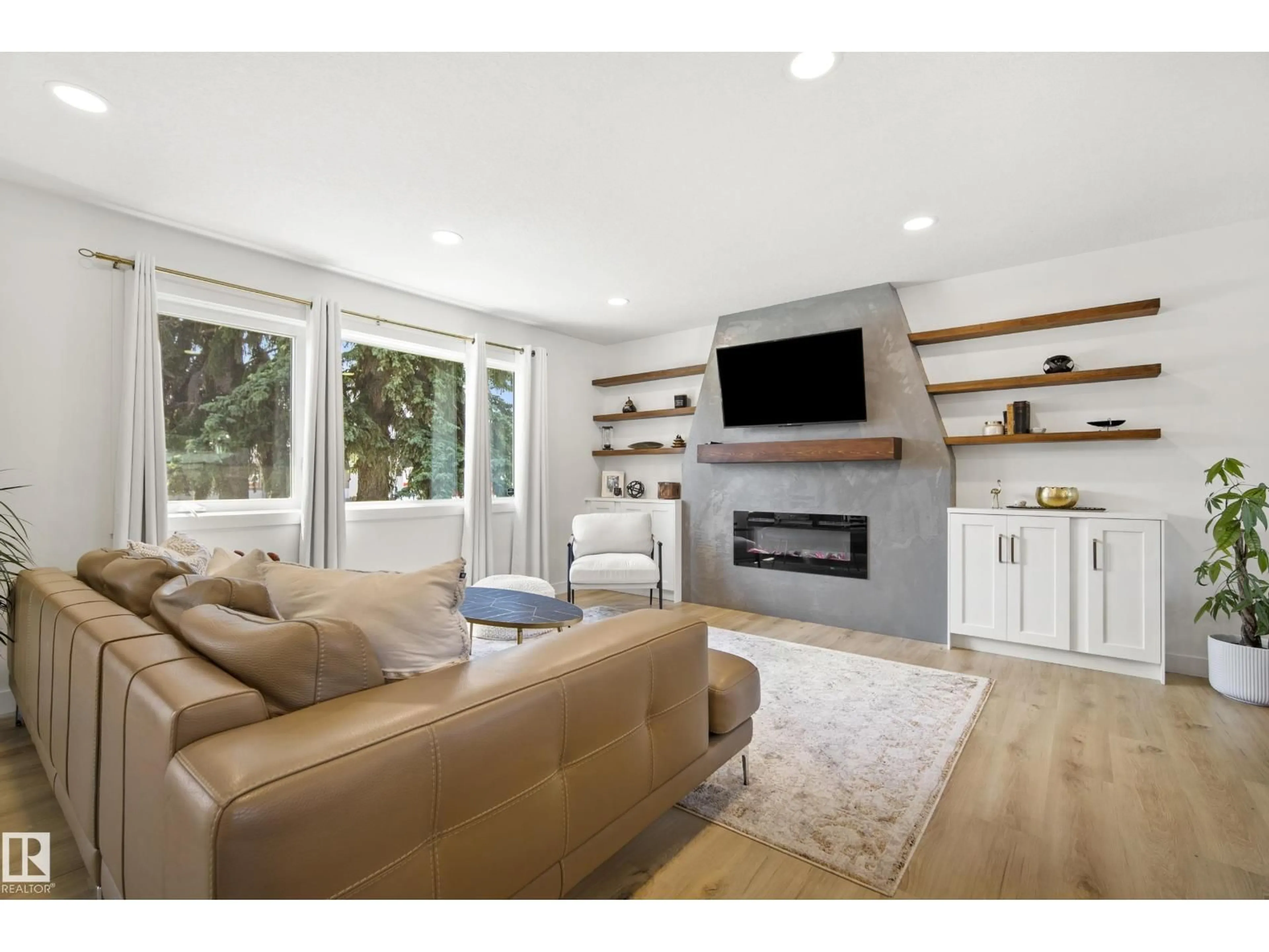 Living room with furniture, wood/laminate floor for NW - 14616 88 AV, Edmonton Alberta T5R4J8
