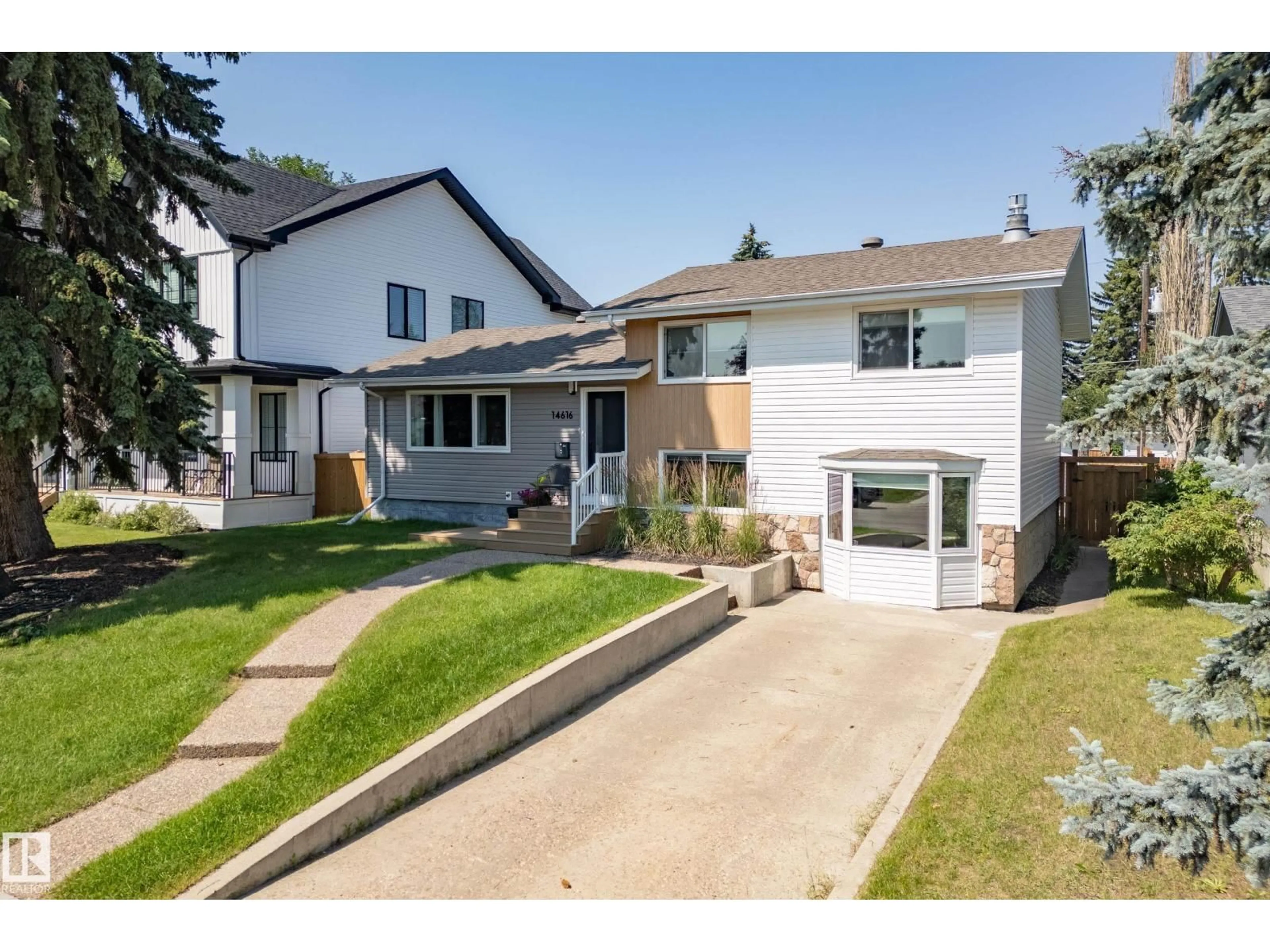 Home with vinyl exterior material, street for NW - 14616 88 AV, Edmonton Alberta T5R4J8