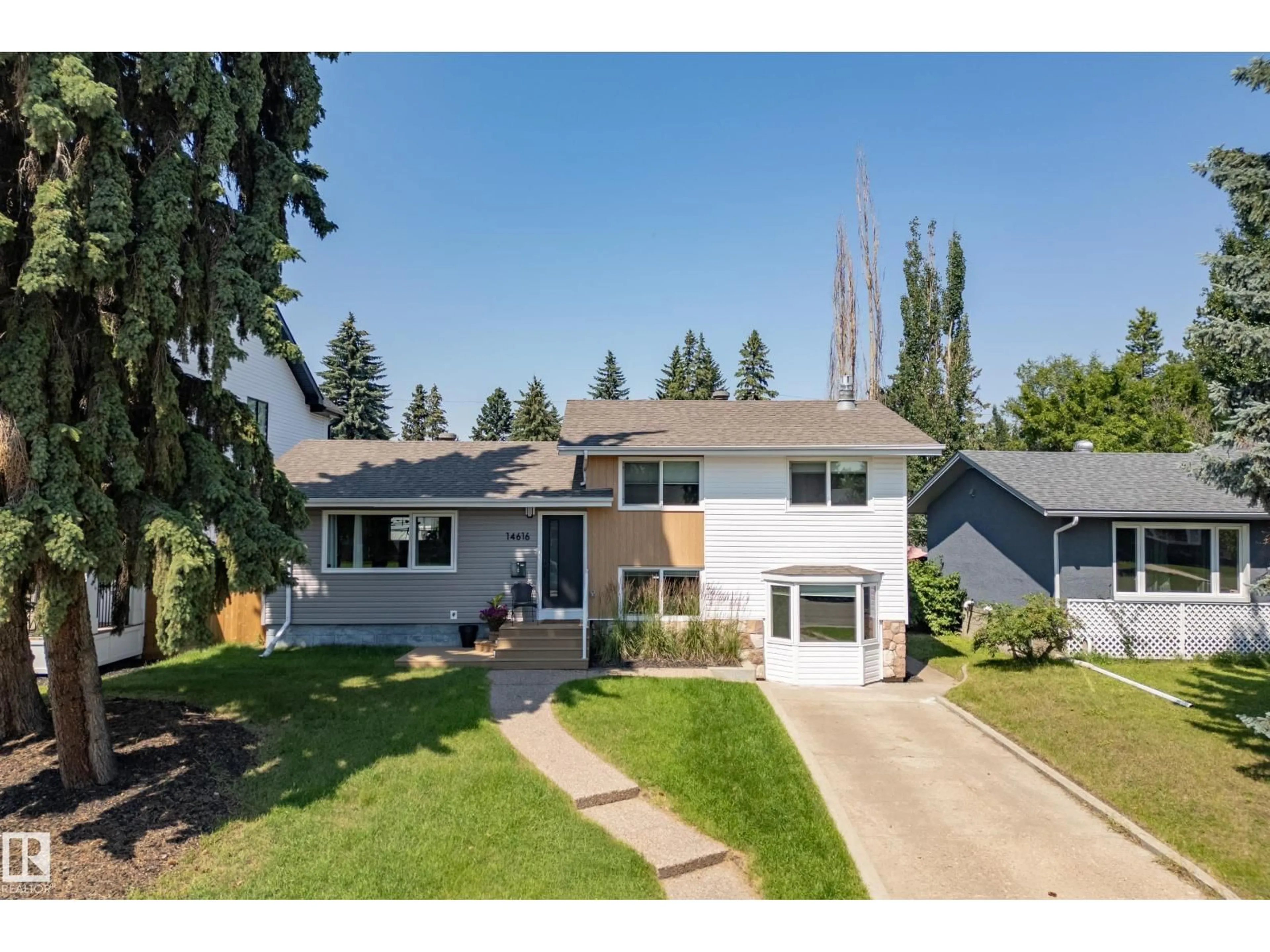 Home with vinyl exterior material, street for NW - 14616 88 AV, Edmonton Alberta T5R4J8