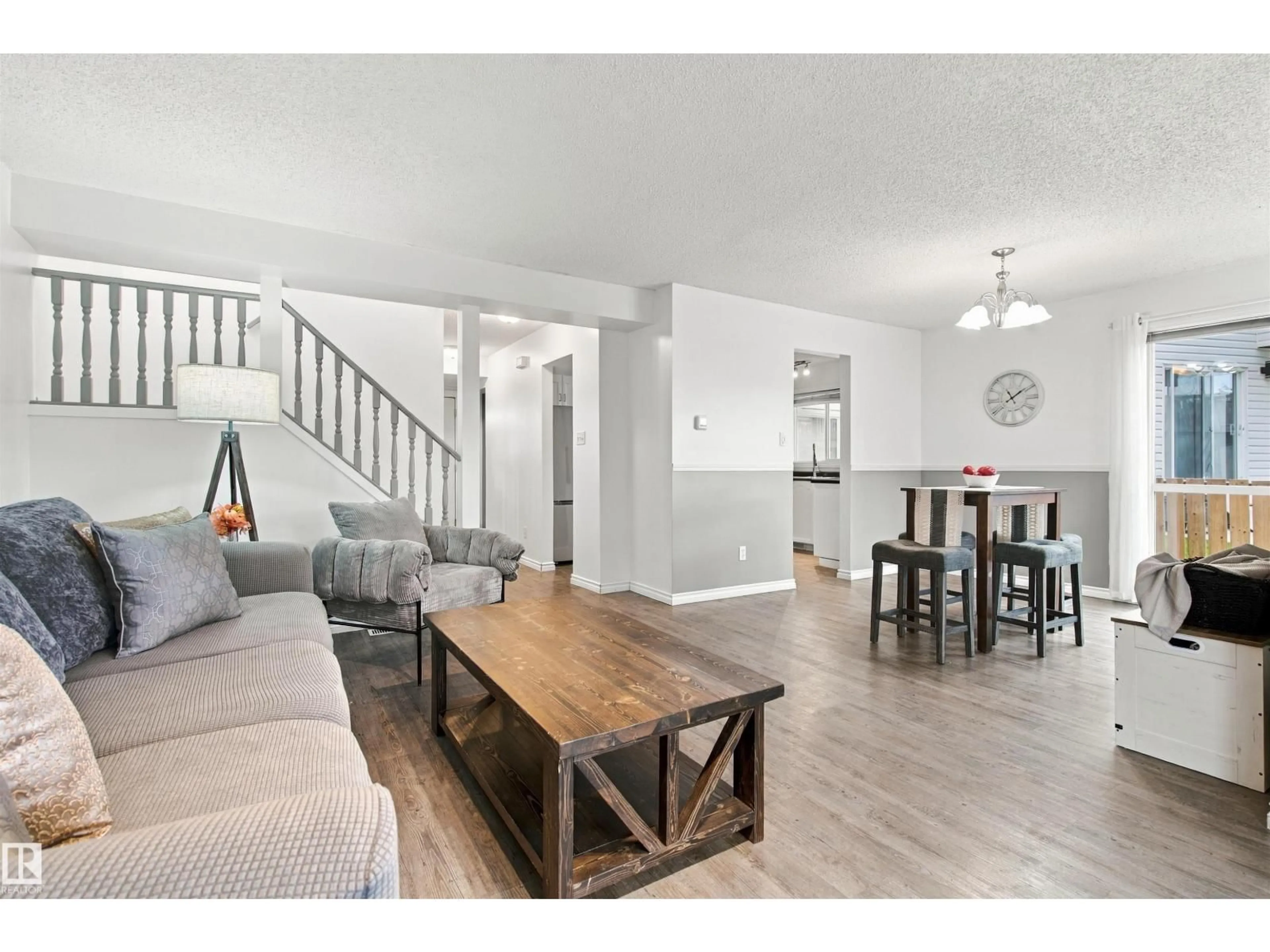 Living room with furniture, wood/laminate floor for 1912 6 ST, Cold Lake Alberta T9M1M3