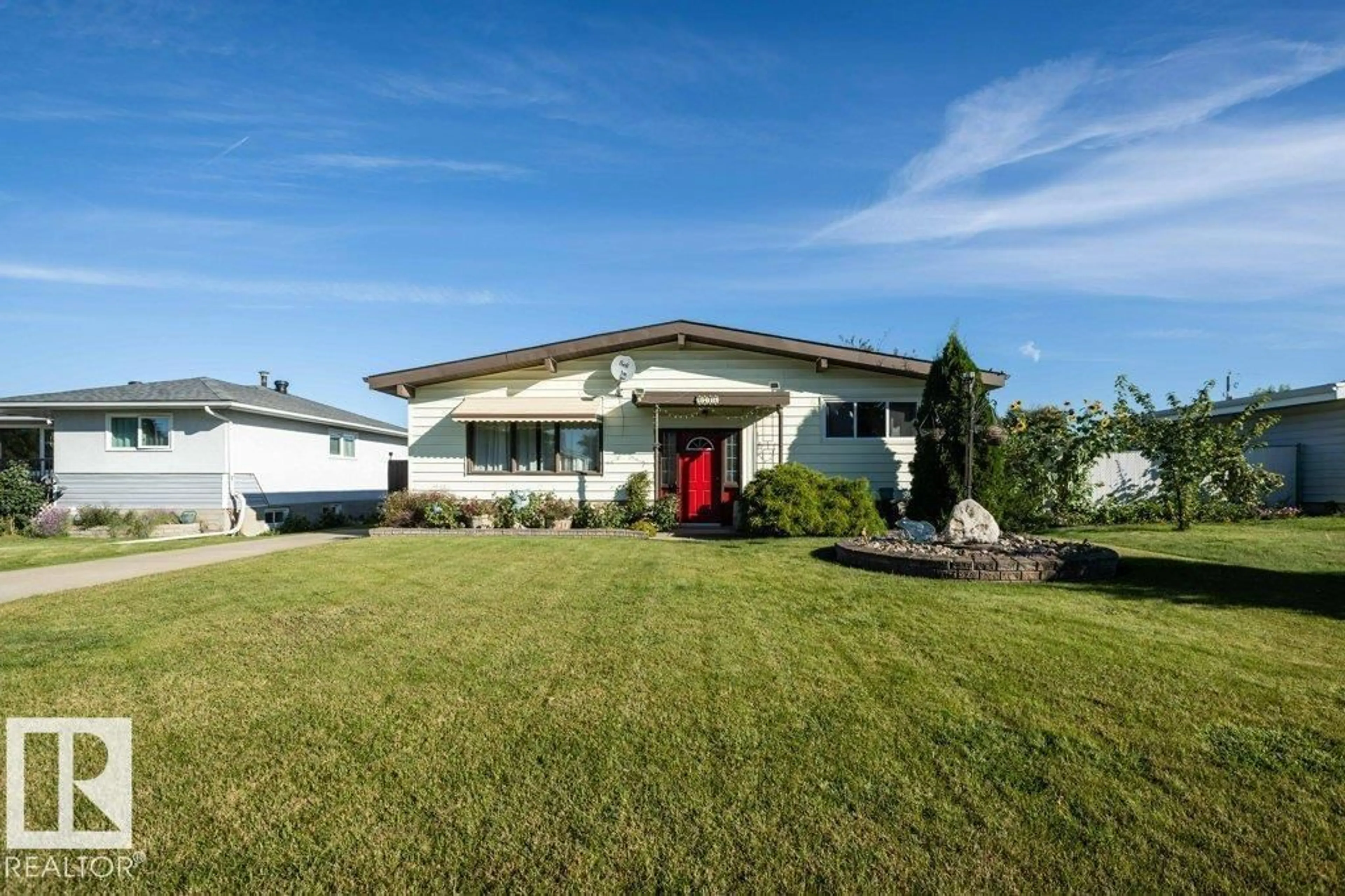 Home with vinyl exterior material, street for 9716 99 ST, Westlock Alberta T7P1Y4