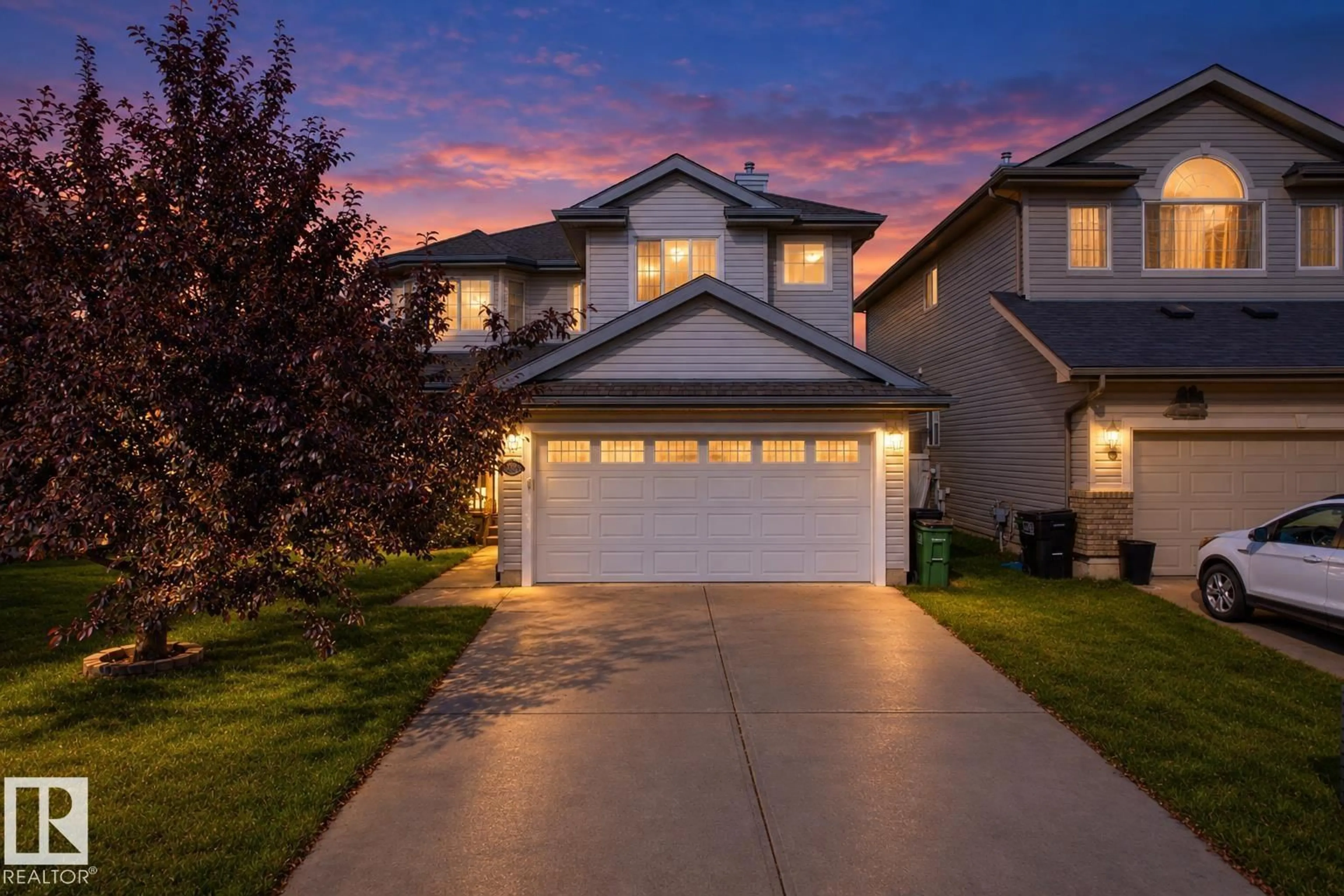 Home with vinyl exterior material, street for NW - 20616 56 AV, Edmonton Alberta T6M0B6