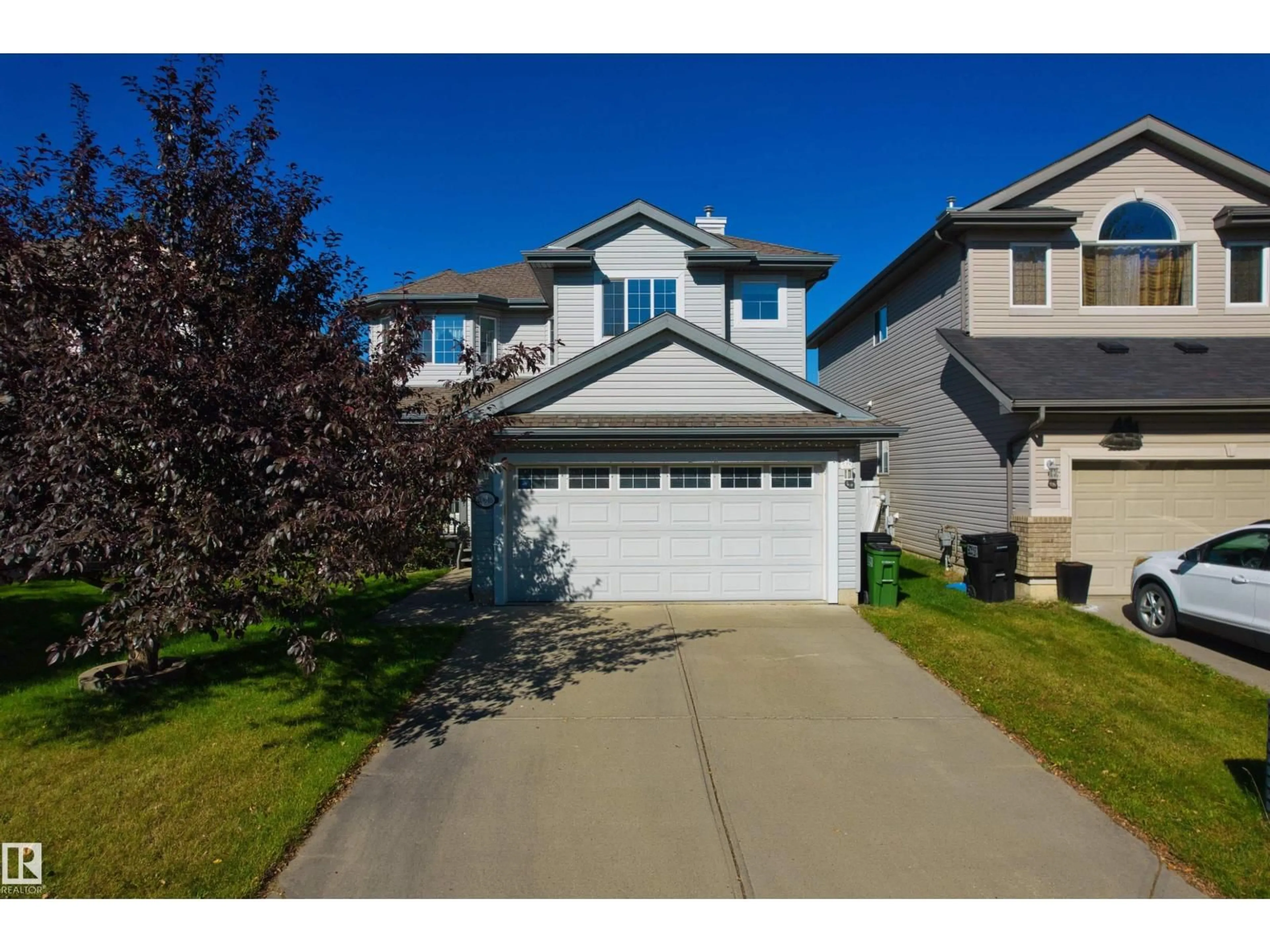 Home with vinyl exterior material, street for NW - 20616 56 AV, Edmonton Alberta T6M0B6
