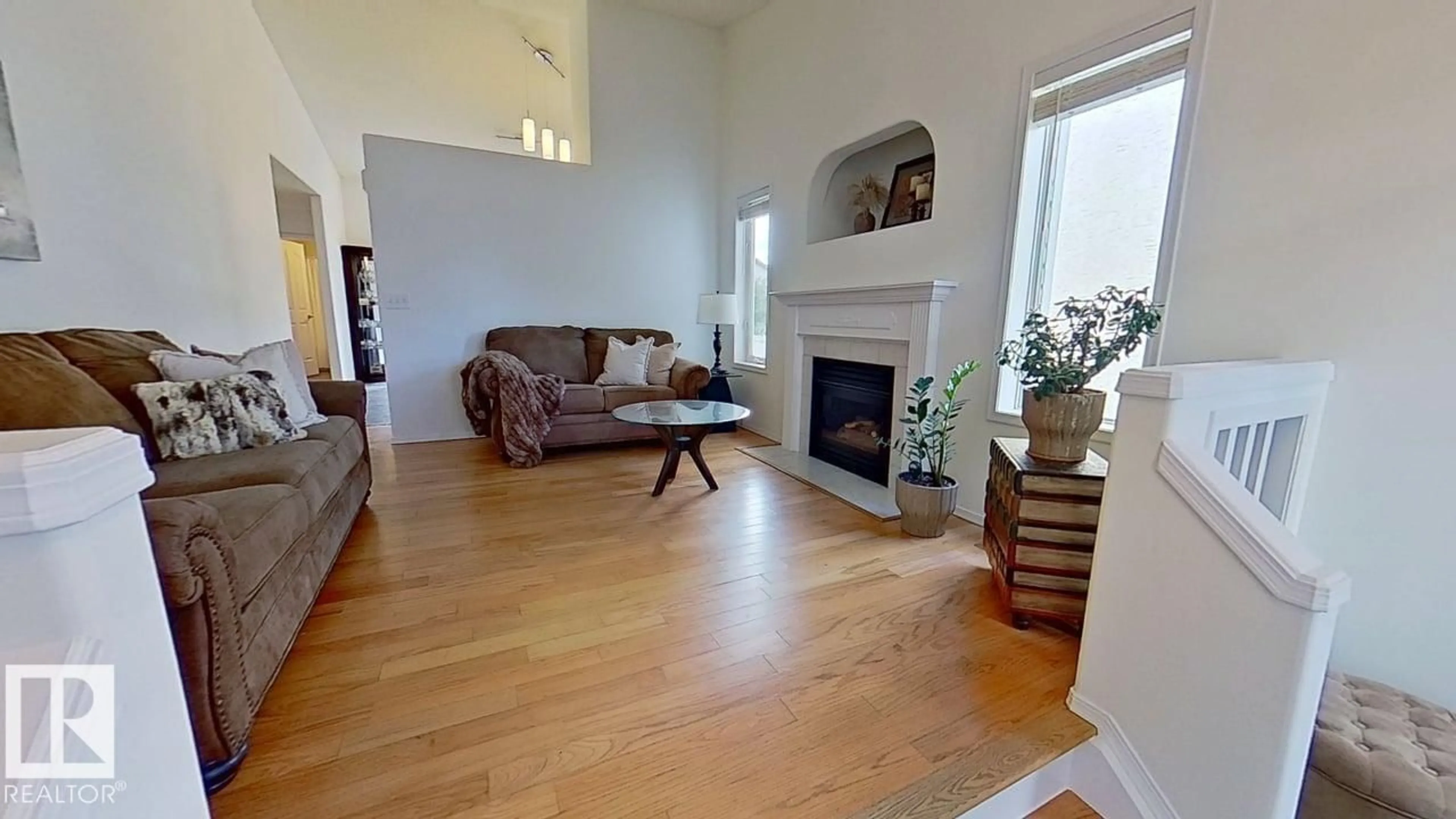 Living room with furniture, wood/laminate floor for NW - 3115 135 AV, Edmonton Alberta T5A5E3