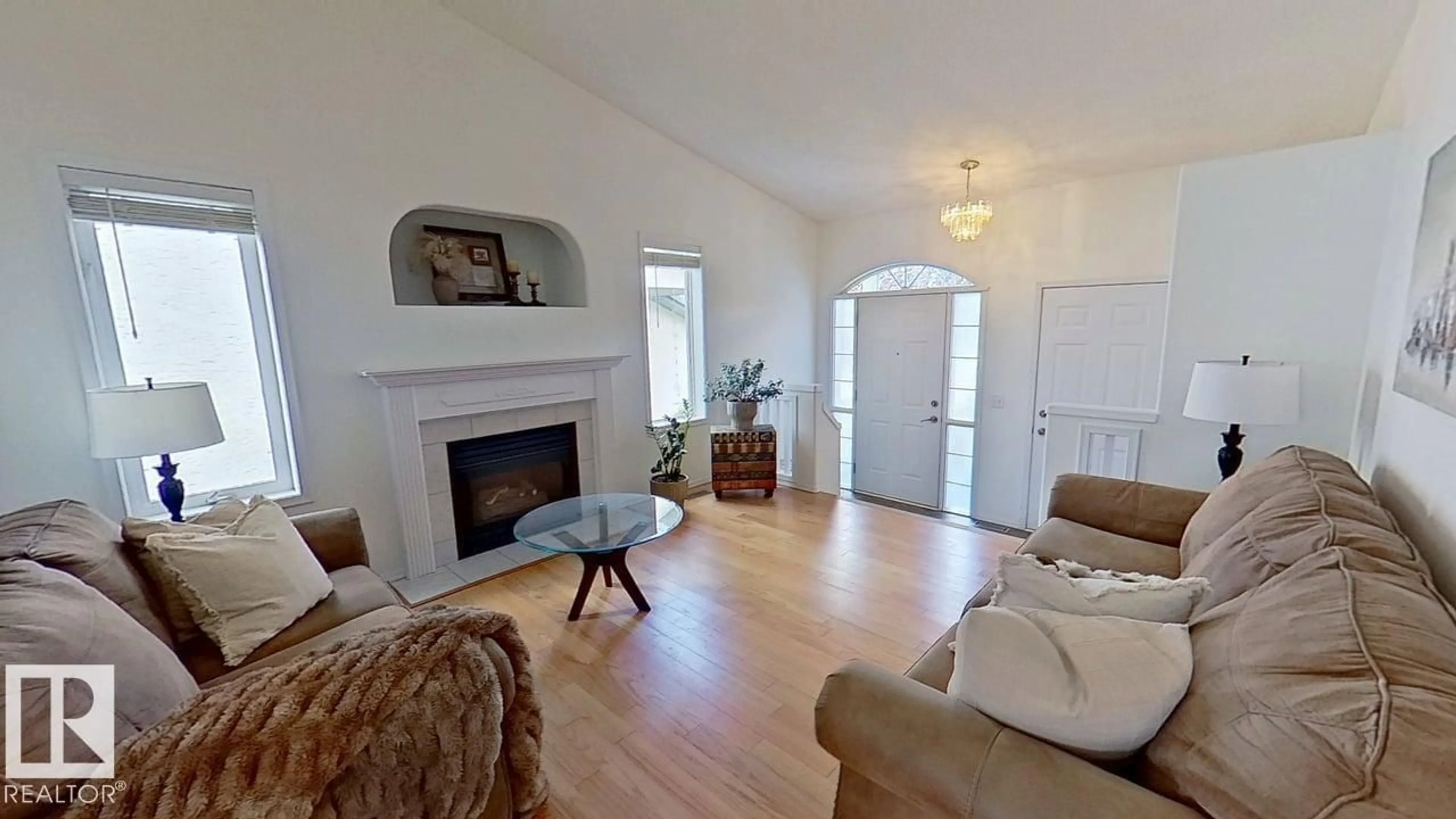 Living room with furniture, wood/laminate floor for NW - 3115 135 AV, Edmonton Alberta T5A5E3