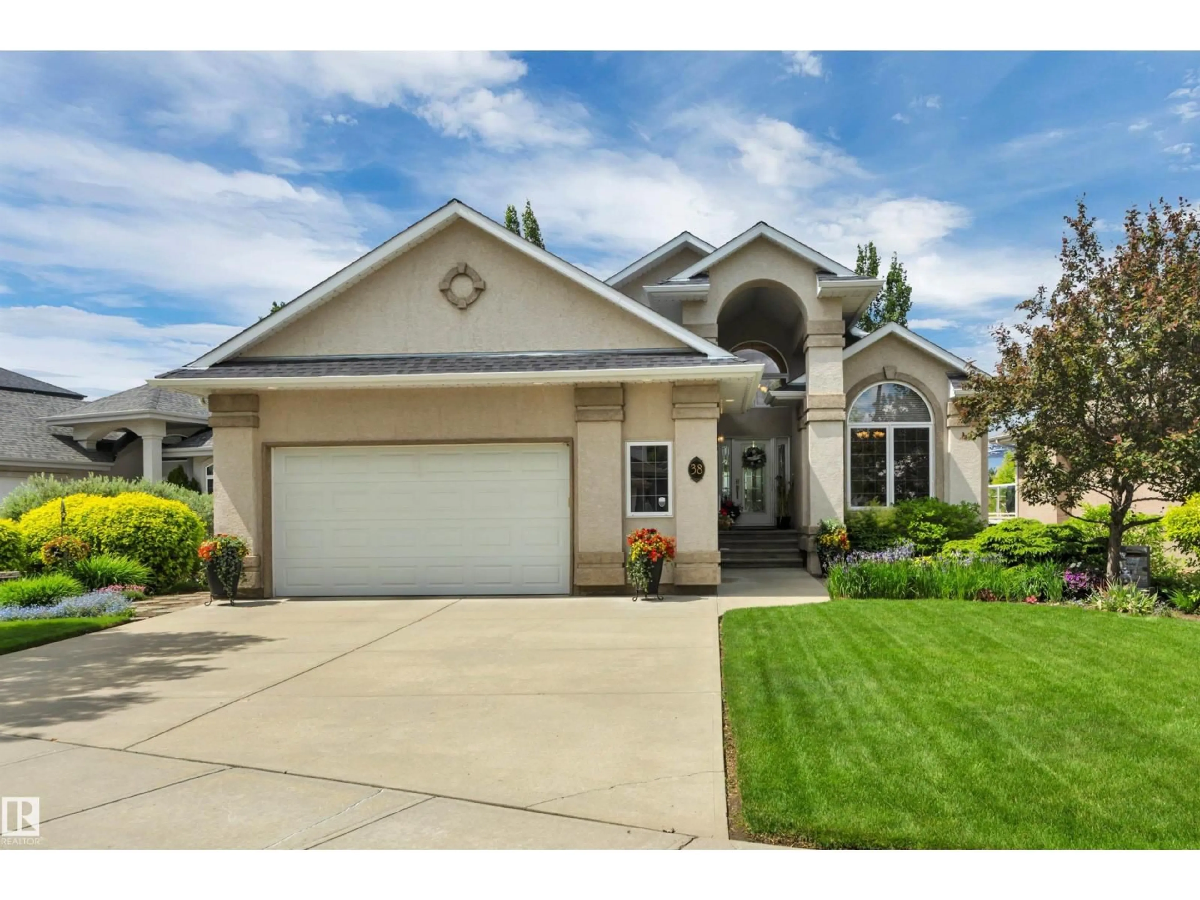Home with vinyl exterior material, street for 38 SHORES DR, Leduc Alberta T9E8N7
