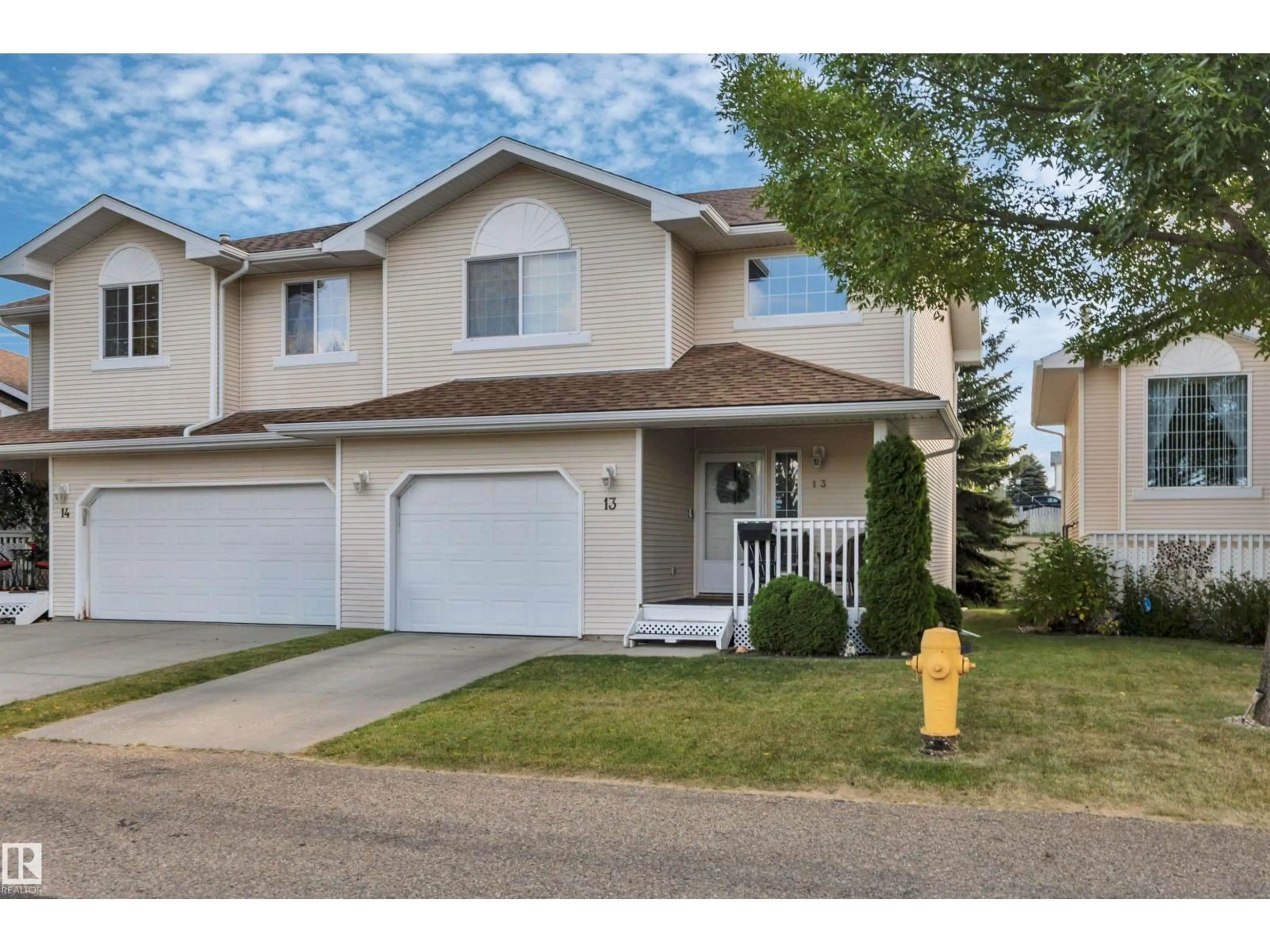 Home with vinyl exterior material, street for #13 - 6608 158 AV, Edmonton Alberta T5Z3H1