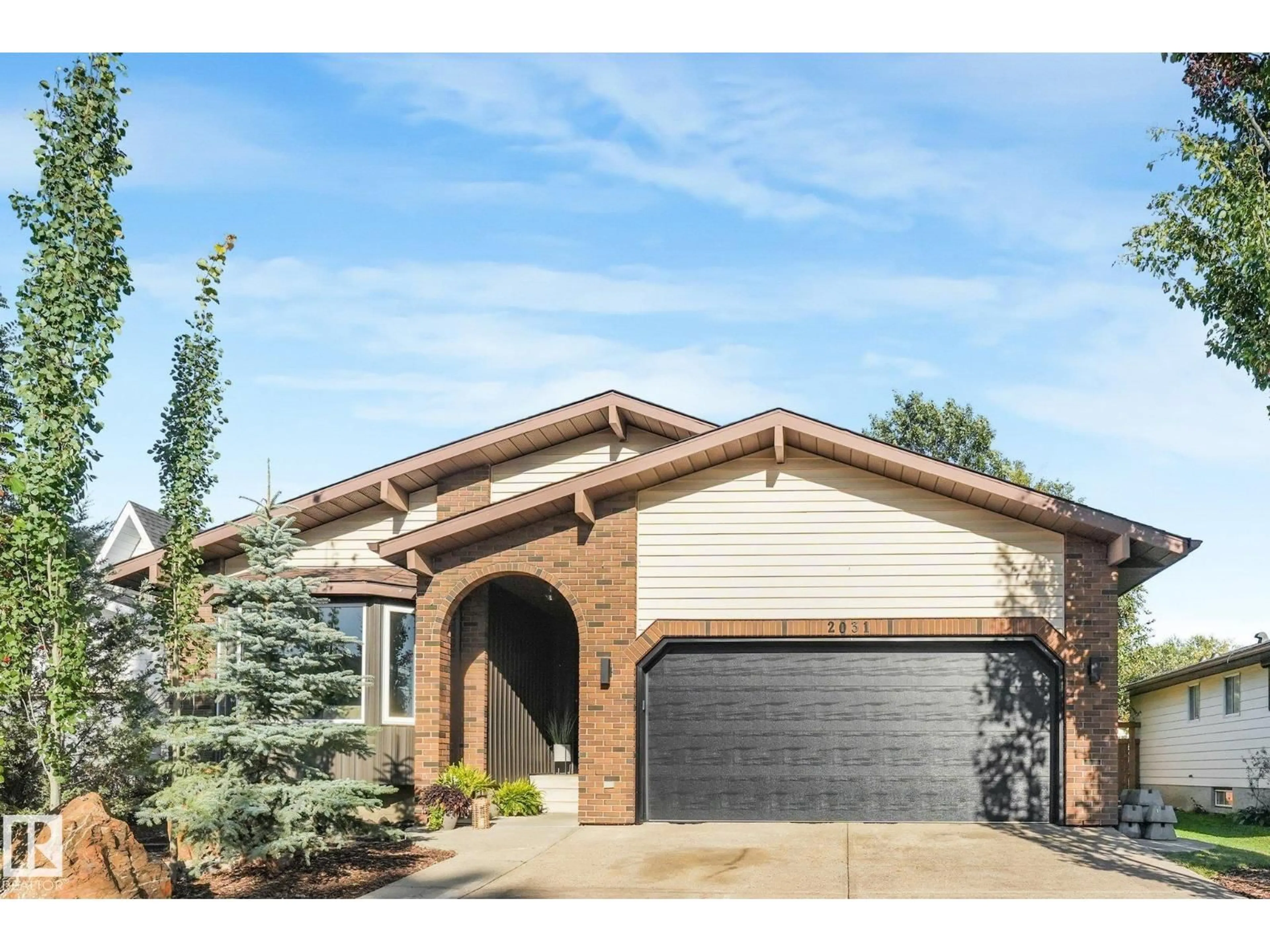 Home with brick exterior material, street for NW - 2031 104A ST, Edmonton Alberta T6J5A6