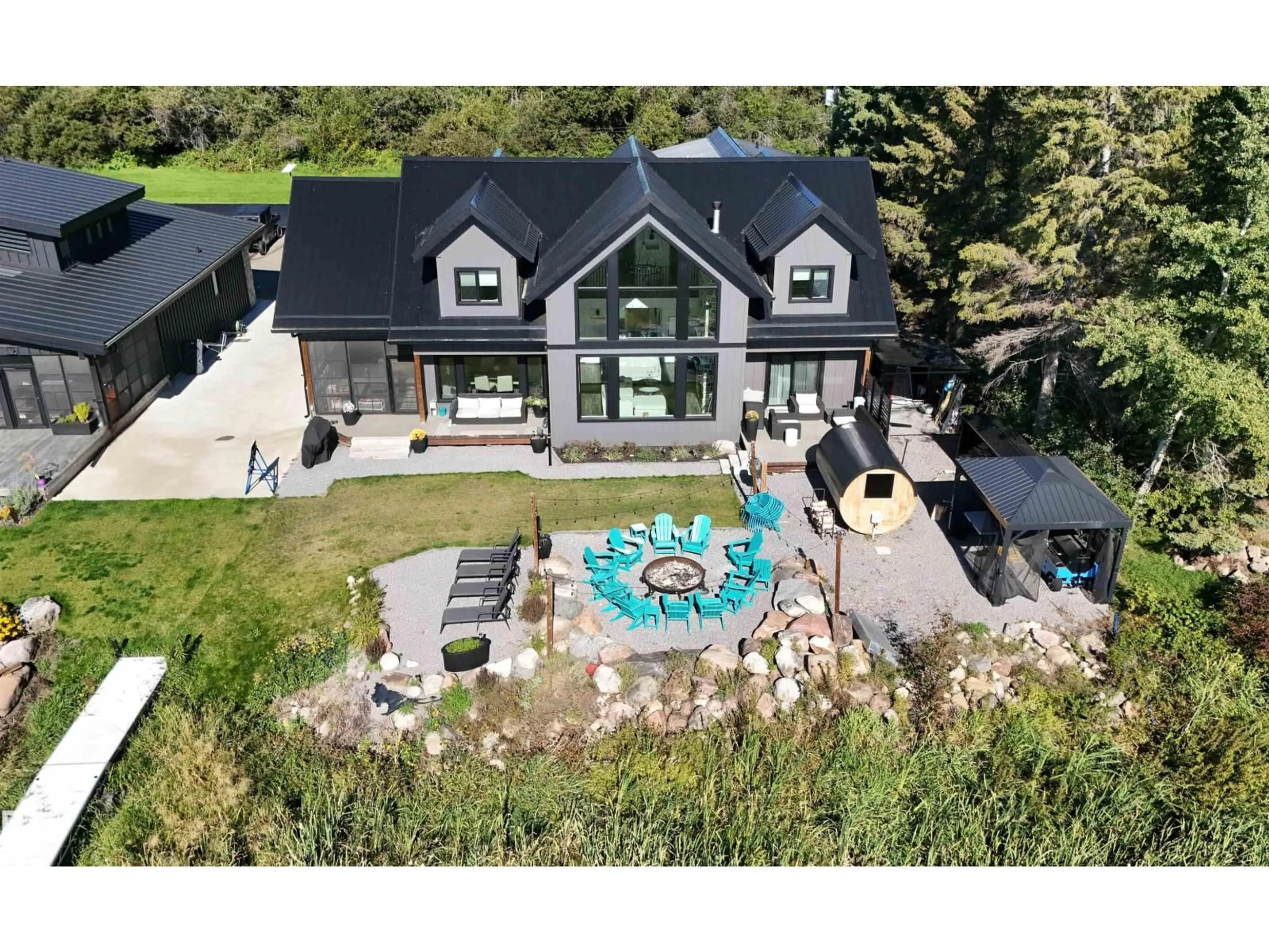 A pic from outside/outdoor area/front of a property/back of a property/a pic from drone, mountain view for 101 ARGENTIA BE, Rural Wetaskiwin County Alberta T0C2C0