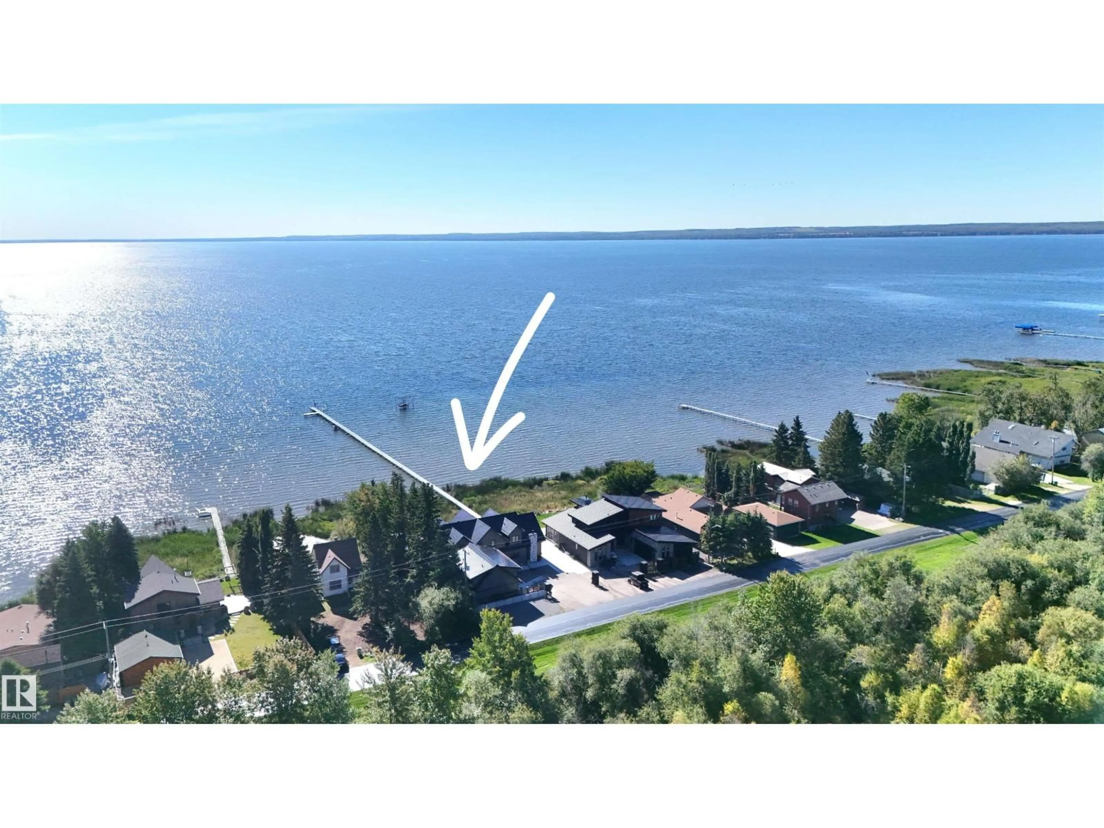 A pic from outside/outdoor area/front of a property/back of a property/a pic from drone, water/lake/river/ocean view for 101 ARGENTIA BE, Rural Wetaskiwin County Alberta T0C2C0