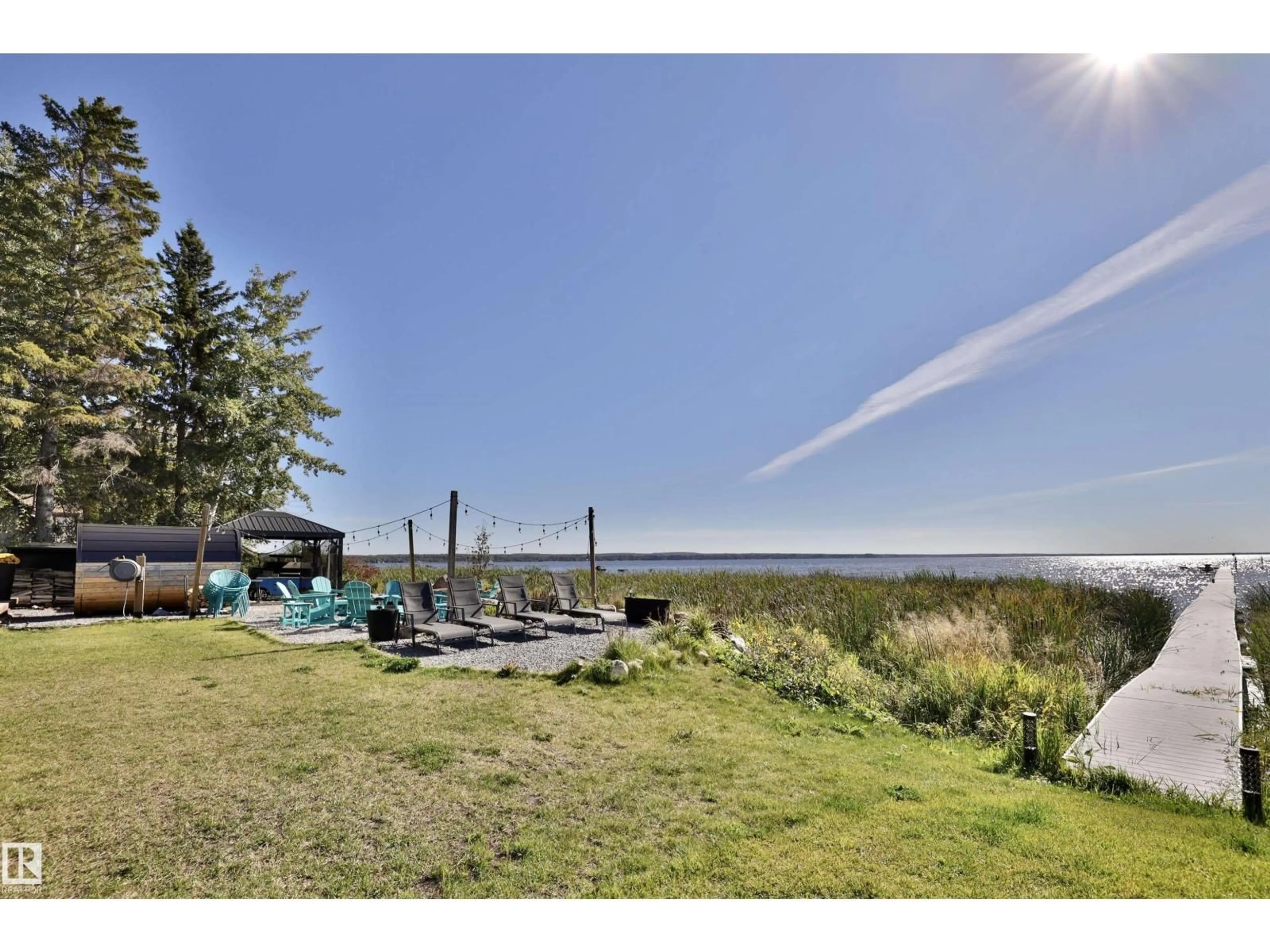 A pic from outside/outdoor area/front of a property/back of a property/a pic from drone, water/lake/river/ocean view for 101 ARGENTIA BE, Rural Wetaskiwin County Alberta T0C2C0